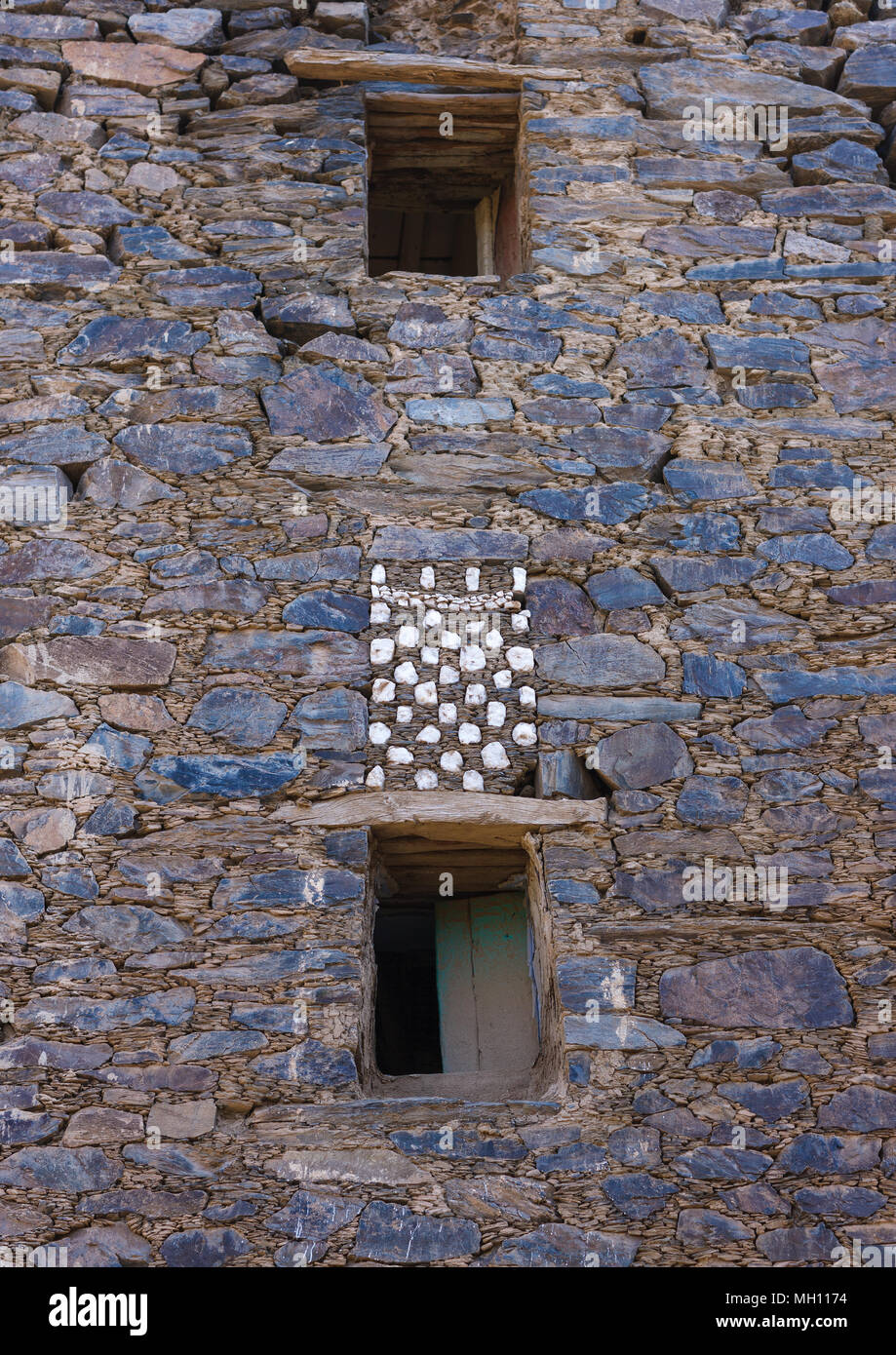 Window in rijal alma traditional village with typical aseeri