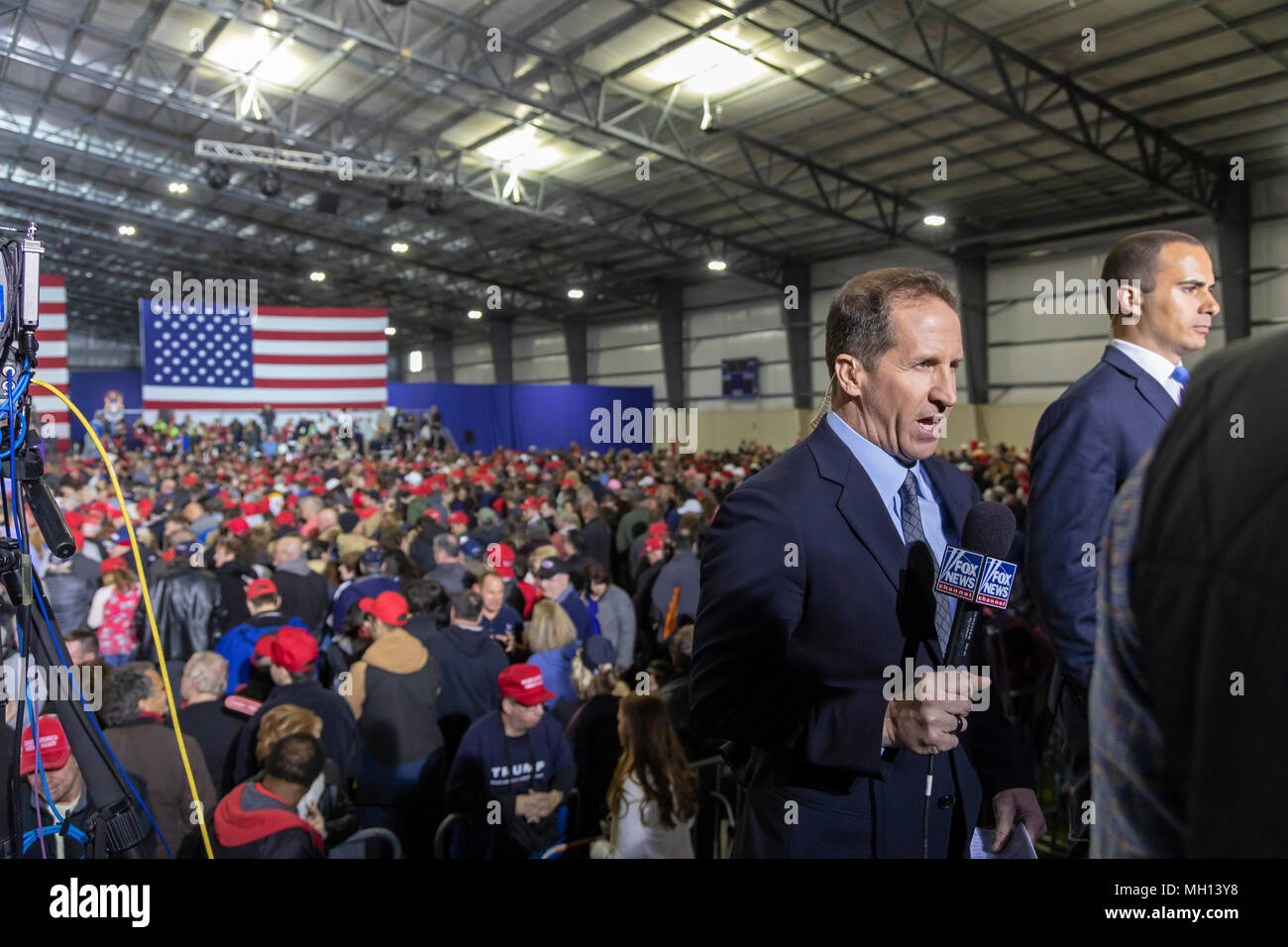 Washington Township, Michigan USA - A Fox News reporter broadcasts live during President Donald Trump's campaign rally in Macomb County, Michigan, whi Stock Photo