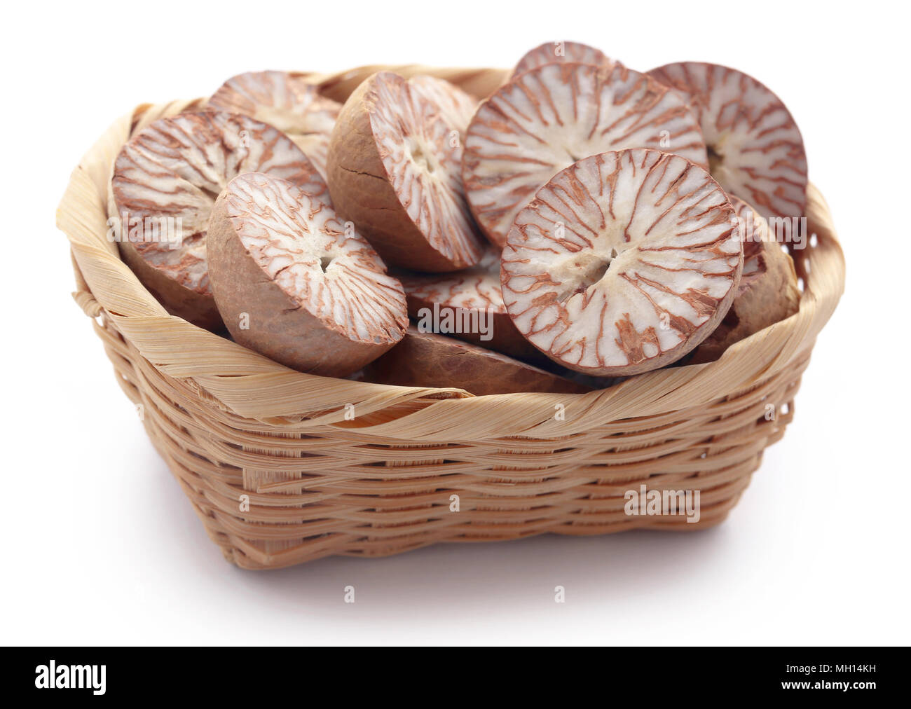 Betel nuts in a basket over white background Stock Photo