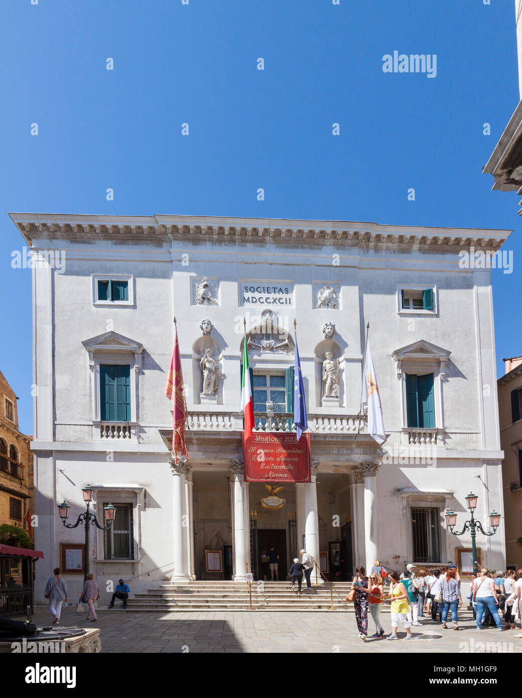 Exterior front facade of La Fenice Opera House (Teatro La Fenice), San  Marco, Venice, Veneto, Italy with a tour group in Campo San Fantin Stock  Photo - Alamy