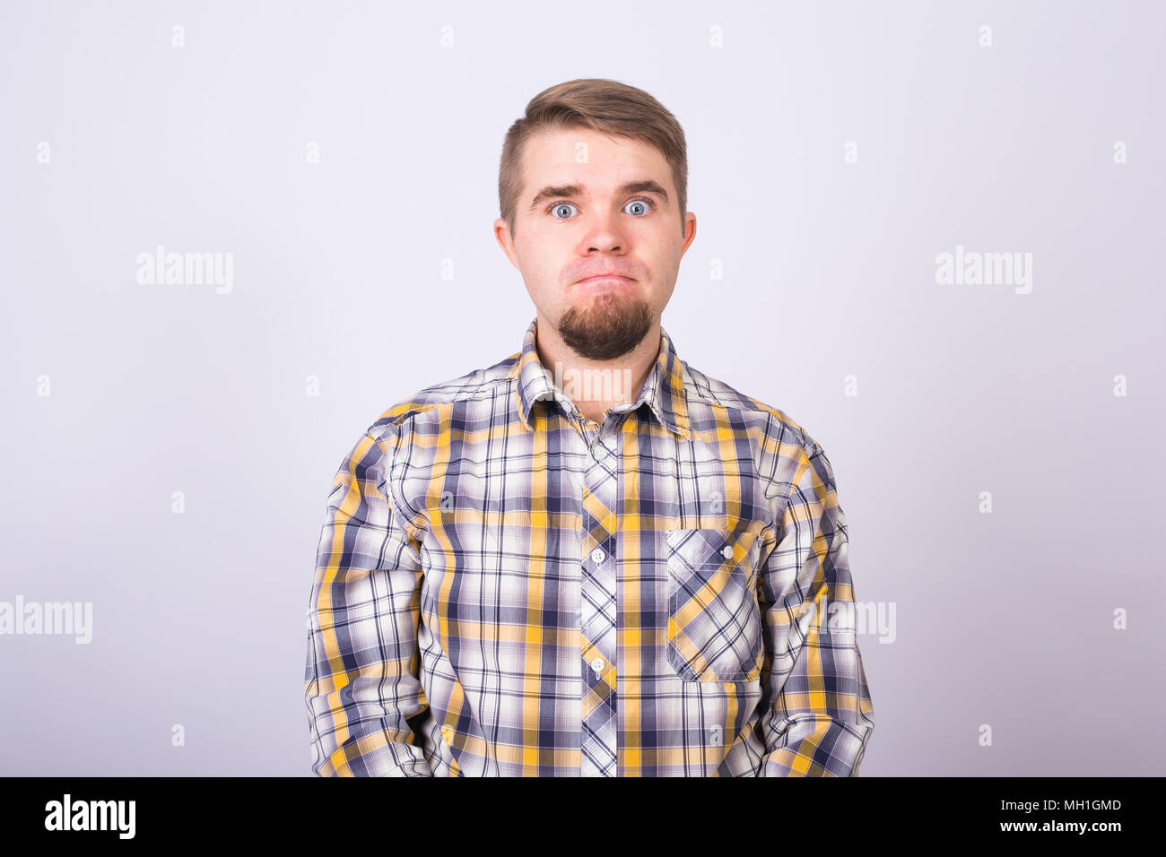Portrait of a handsome young man against white background Stock Photo ...