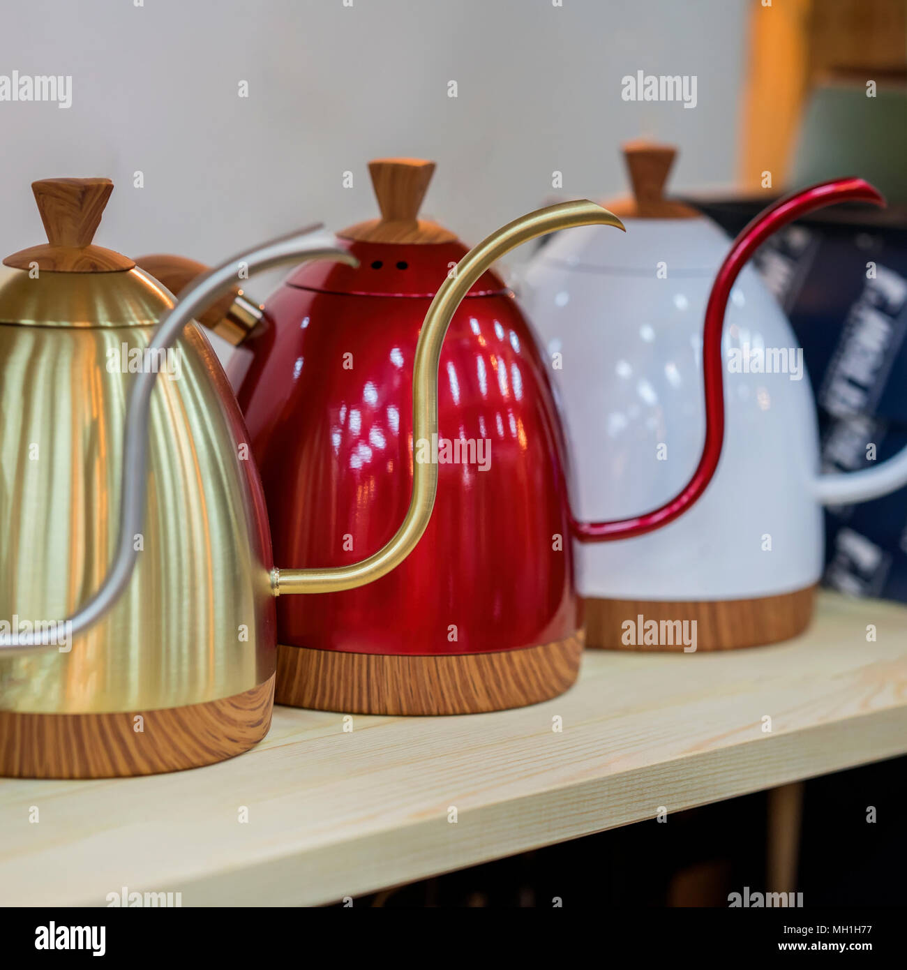 https://c8.alamy.com/comp/MH1H77/modern-metallic-colorful-teapots-for-filtered-coffee-cafe-shop-MH1H77.jpg