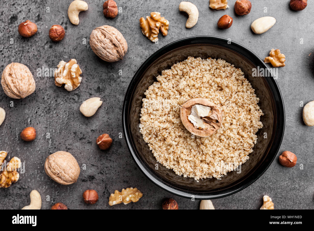 Delicious walnuts on grey rustic background Stock Photo