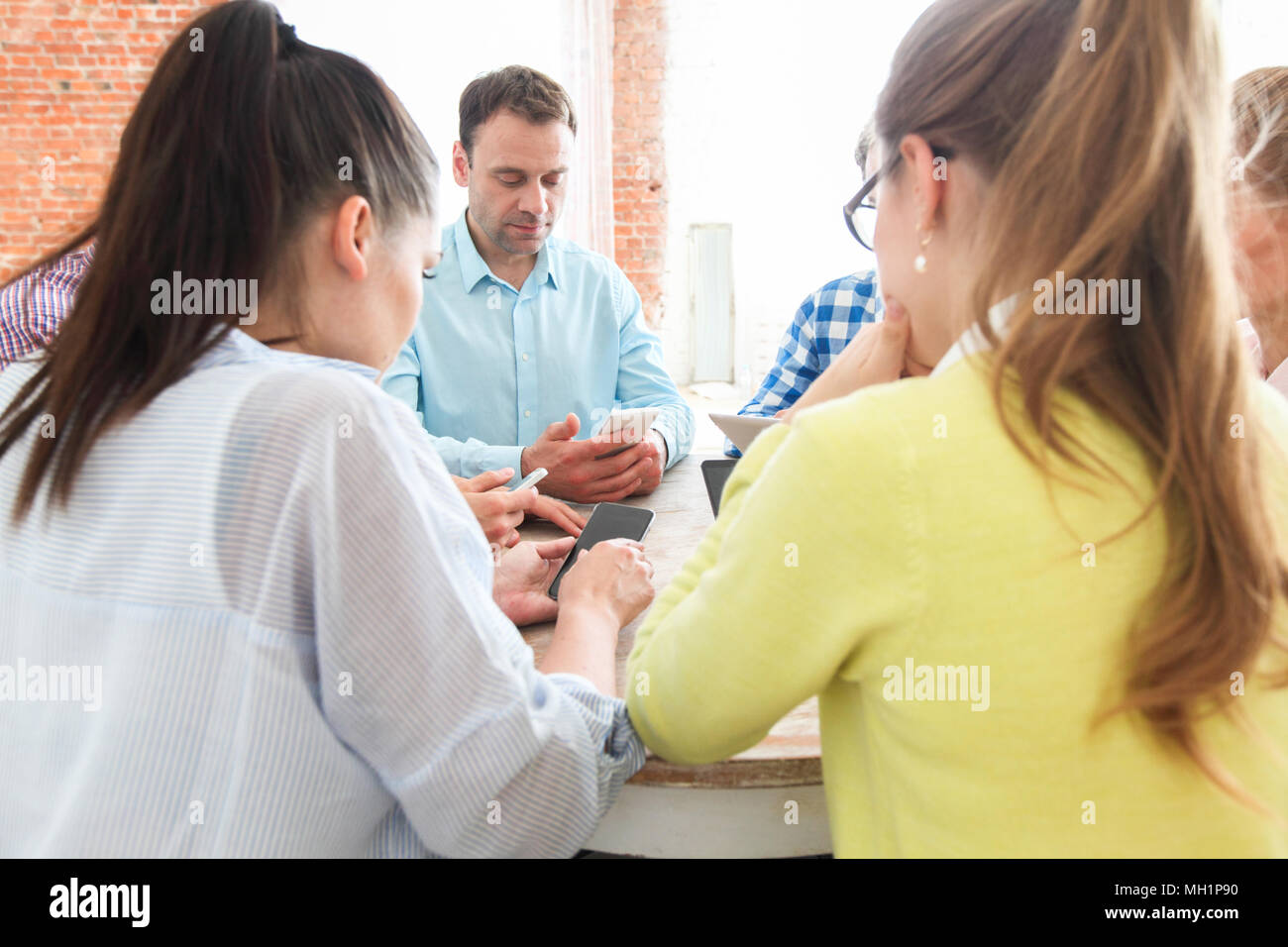 Group of multi generation people use technology together of smartphones ...