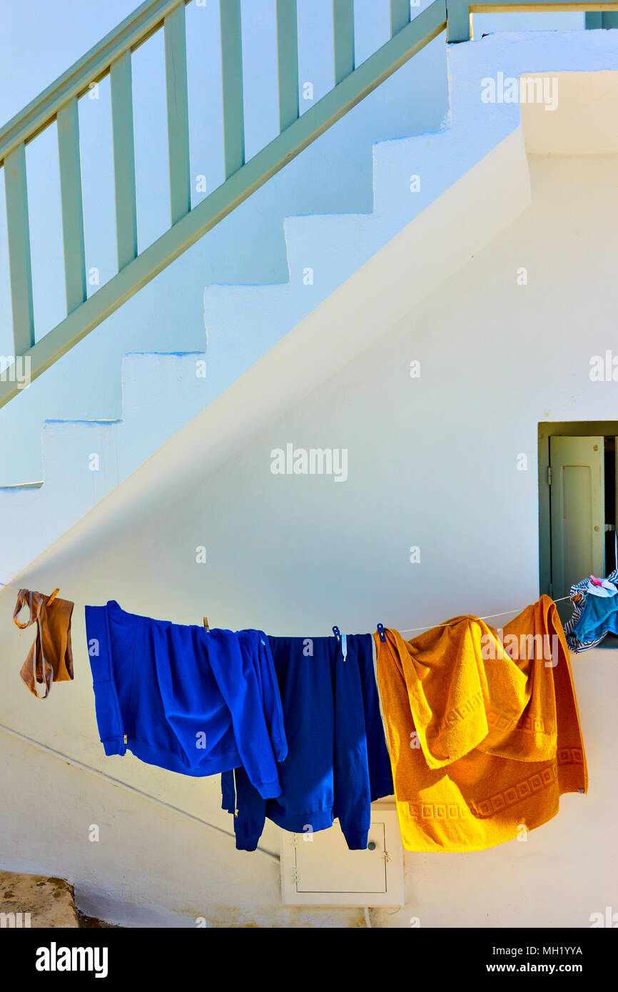 Airing clothes under staircase in Mykonos, Greece Stock Photo