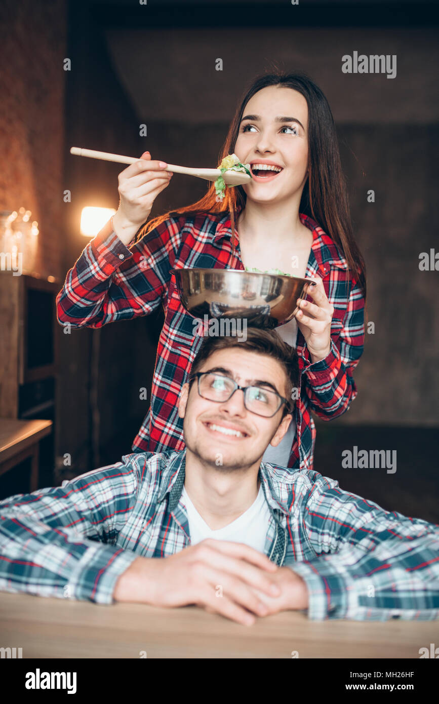 Happy couple cooking vegetable salad together Stock Photo