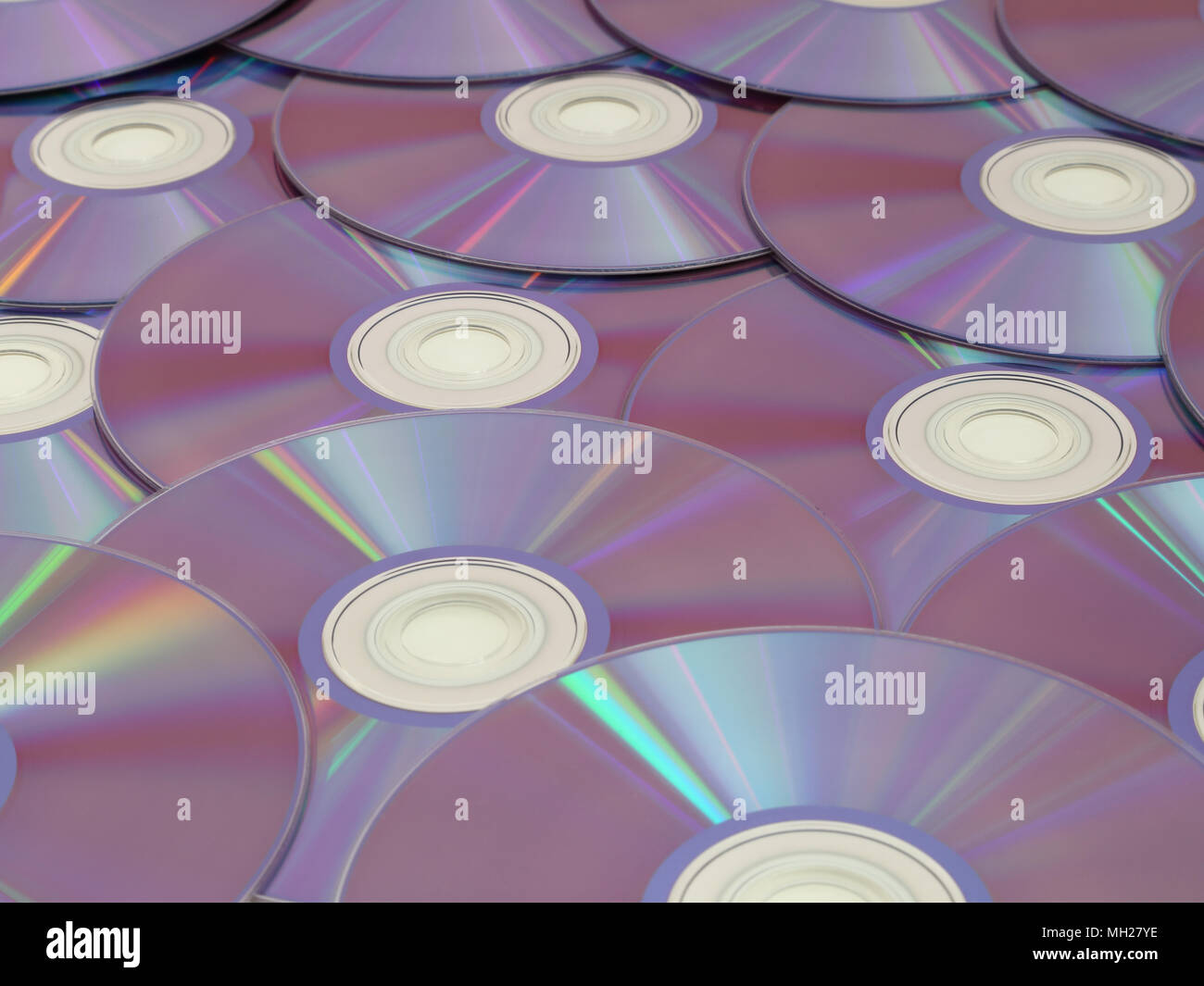 Blank DVDs are on display with the reflective side facing up. Stock Photo