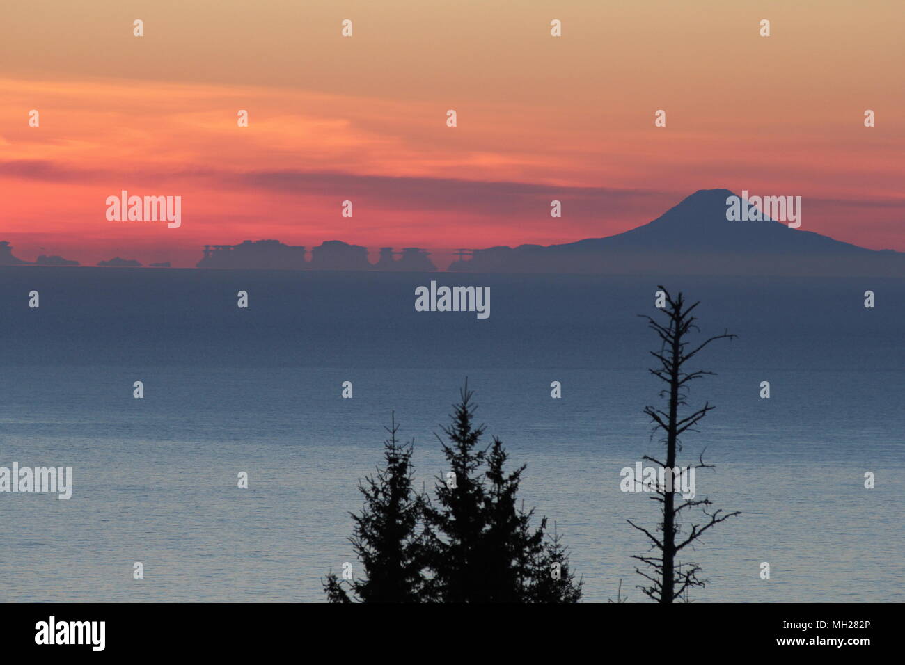 Iliamna Volcano Sunset, Cook Inlet, Alaska Stock Photo