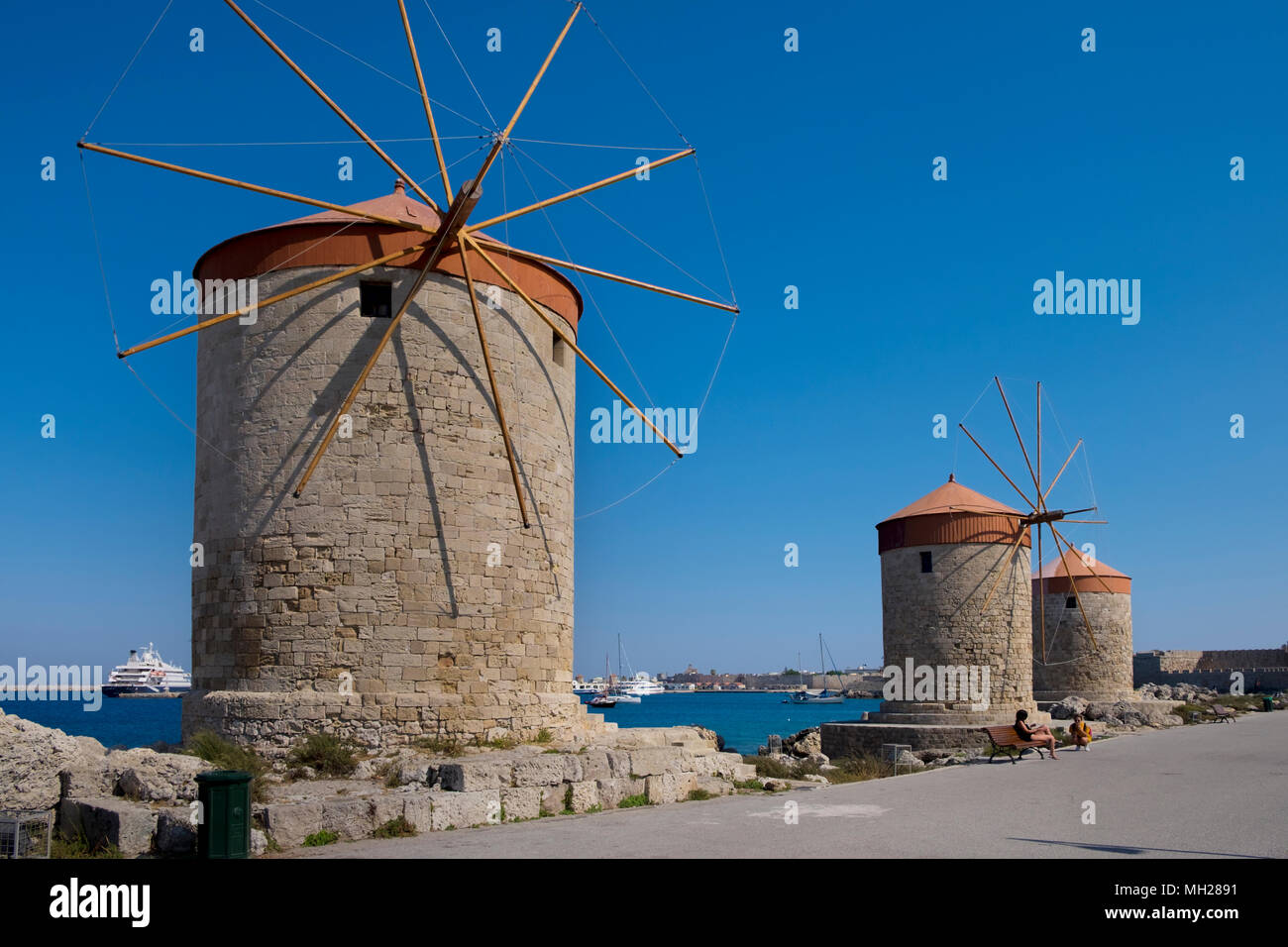 Windmills on the Harbour at Rhodes Town Stock Photo