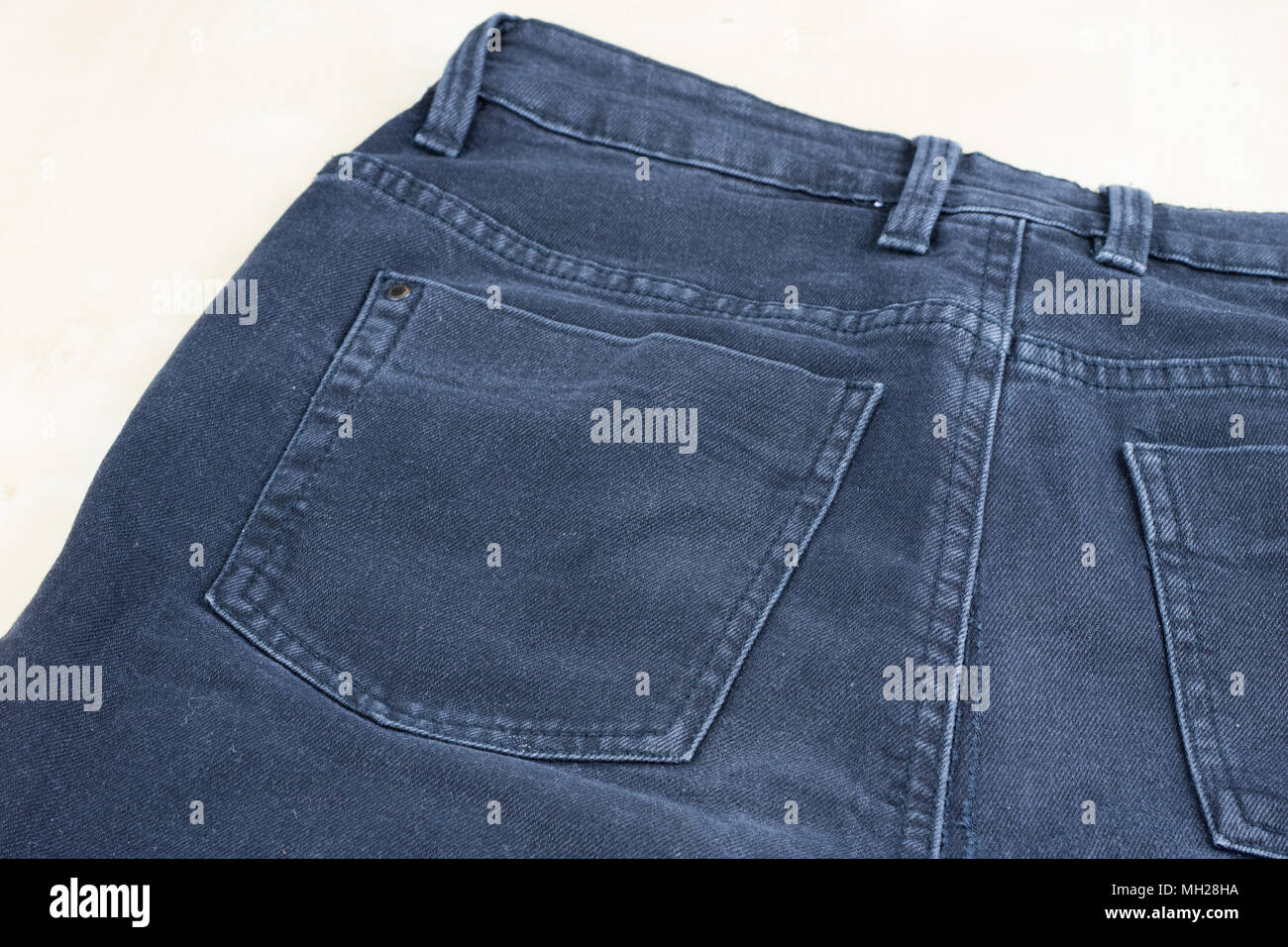 Denim shorts under magnification. Trouser zipper, belt loops and other ...