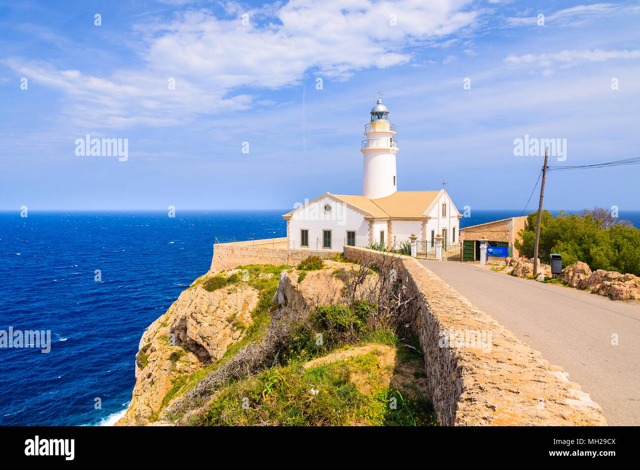 Lighthouse on high cliff above sea in Cala Ratjada, Majorca island, Spain Stock Photo