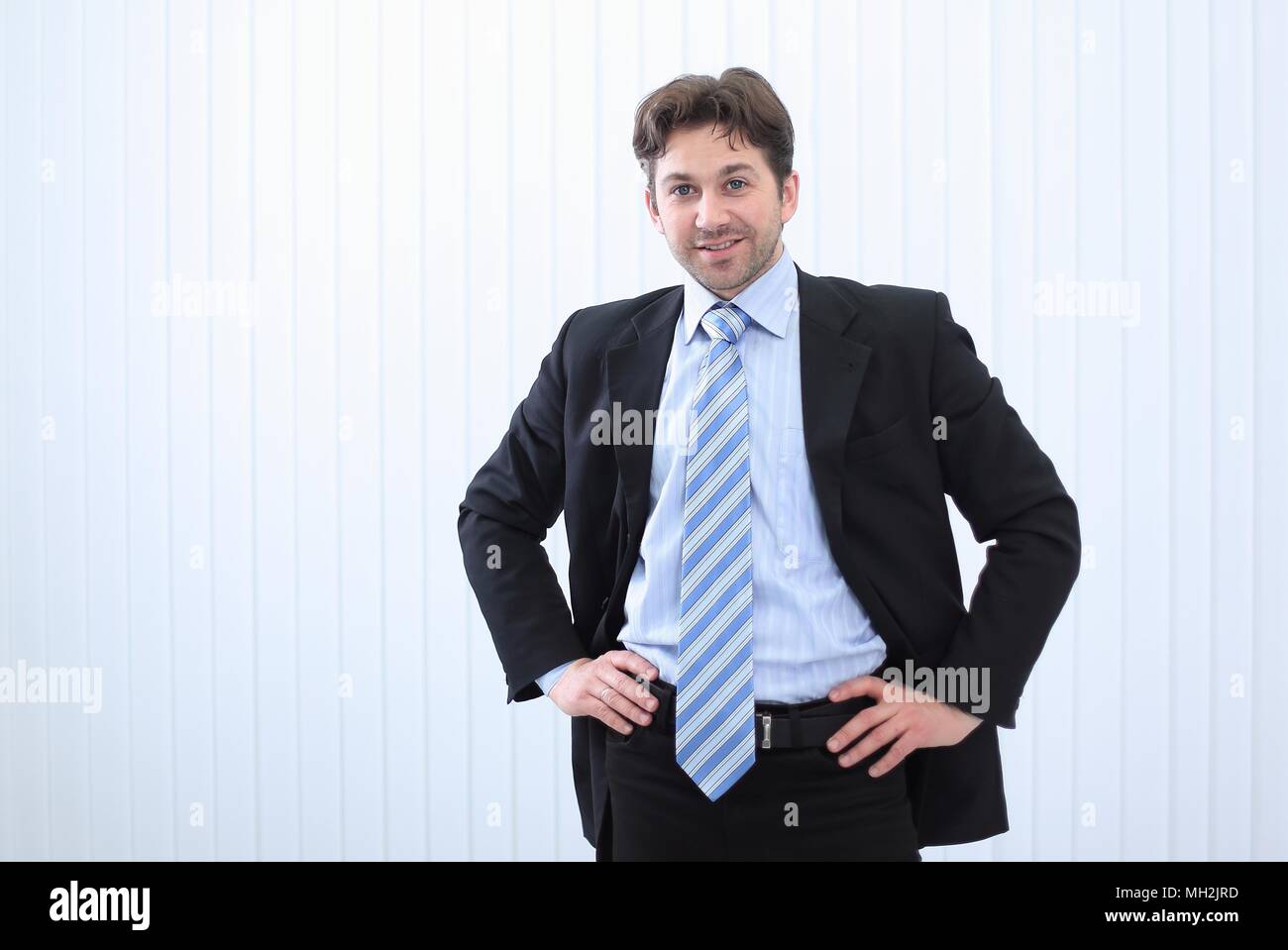 Portrait of happy smiling young businessman Stock Photo - Alamy
