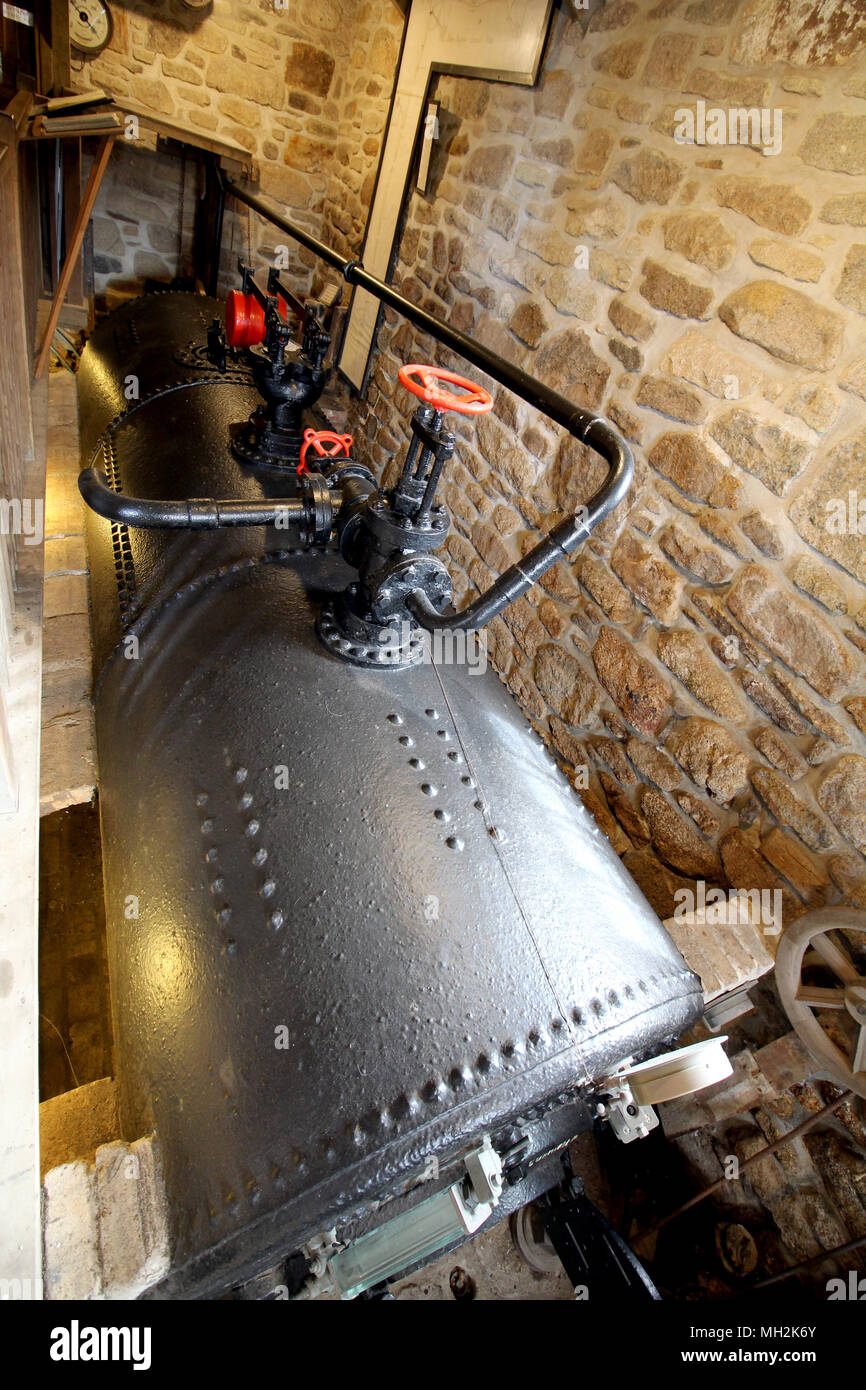 Cast iron coal fired boiler of an industrial steam engine used at a tin