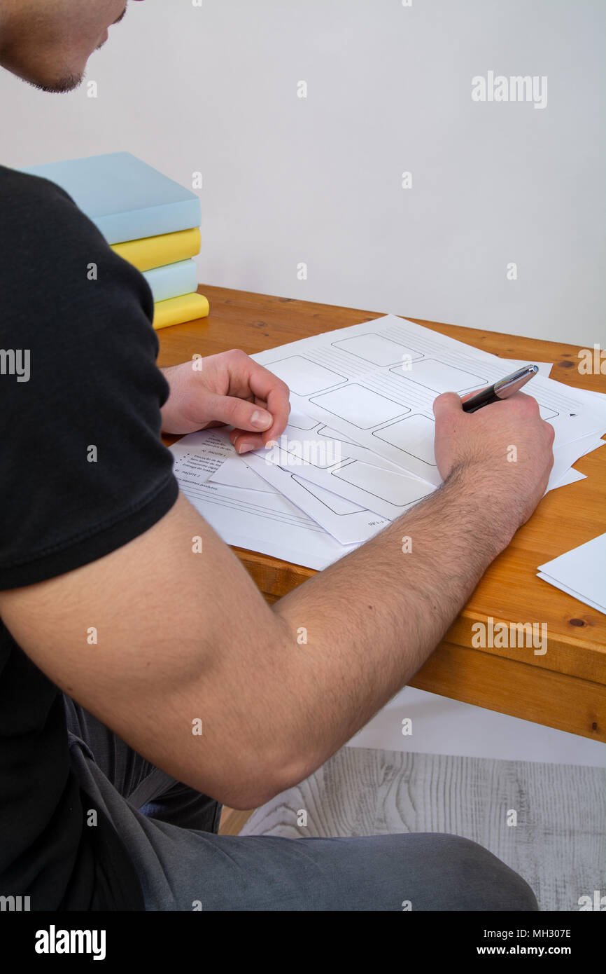 a young man writing, making an argument for a video Stock Photo