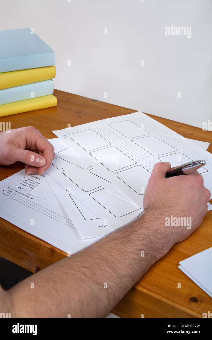 a young man writing, making an argument for a video Stock Photo