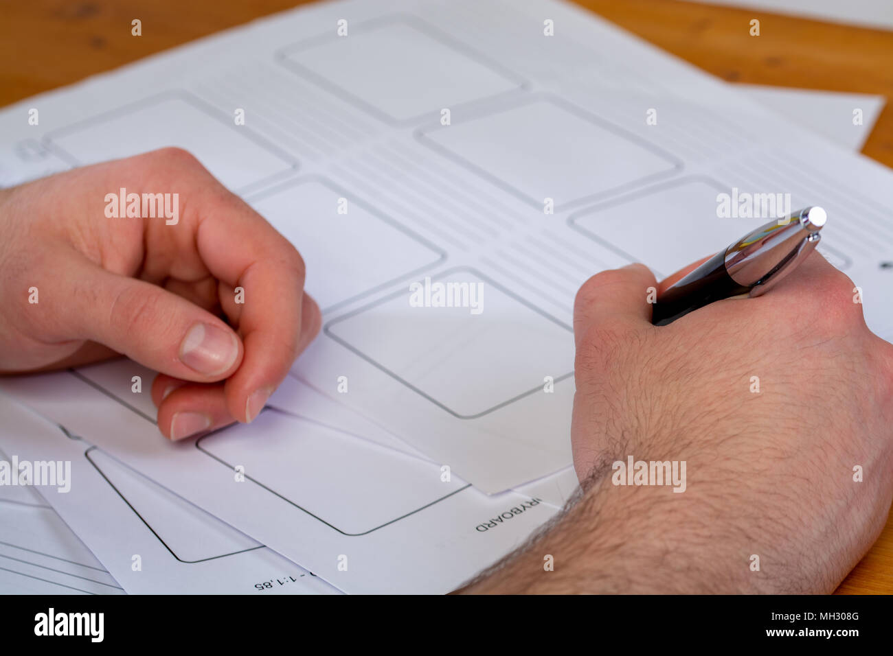 a young man writing, making an argument for a video Stock Photo
