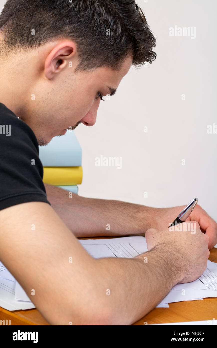 a young man writing, making an argument for a video Stock Photo