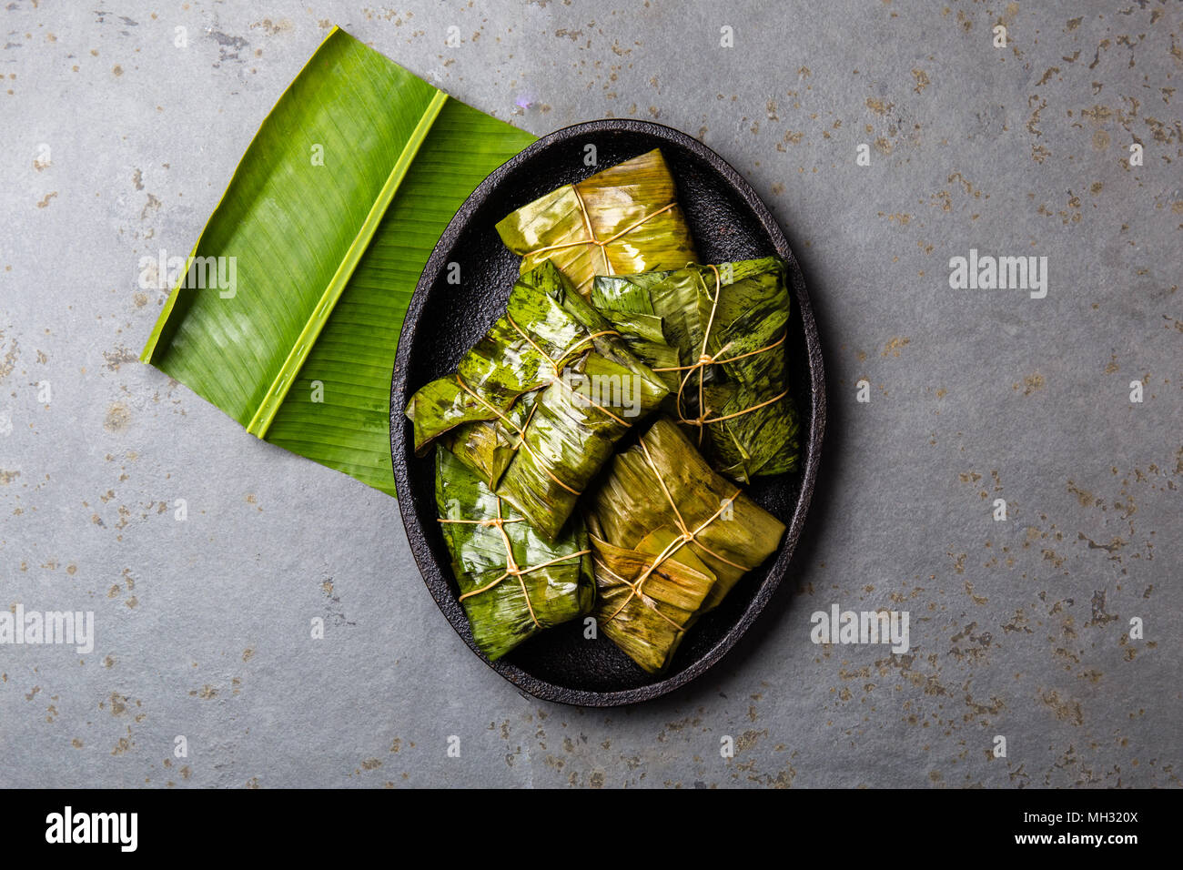 COLOMBIAN, CENTRAL AMERICAN FOOD. Tamales wrapped in banana palm tree