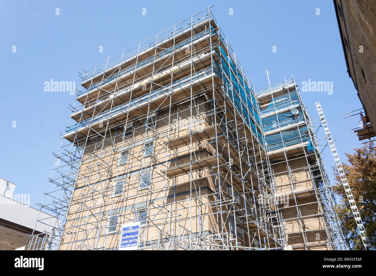 Building covered in scaffolding, Chiswick High Street, Chiswick, London Borough of Hounslow, Greater London, England, United Kingdom Stock Photo