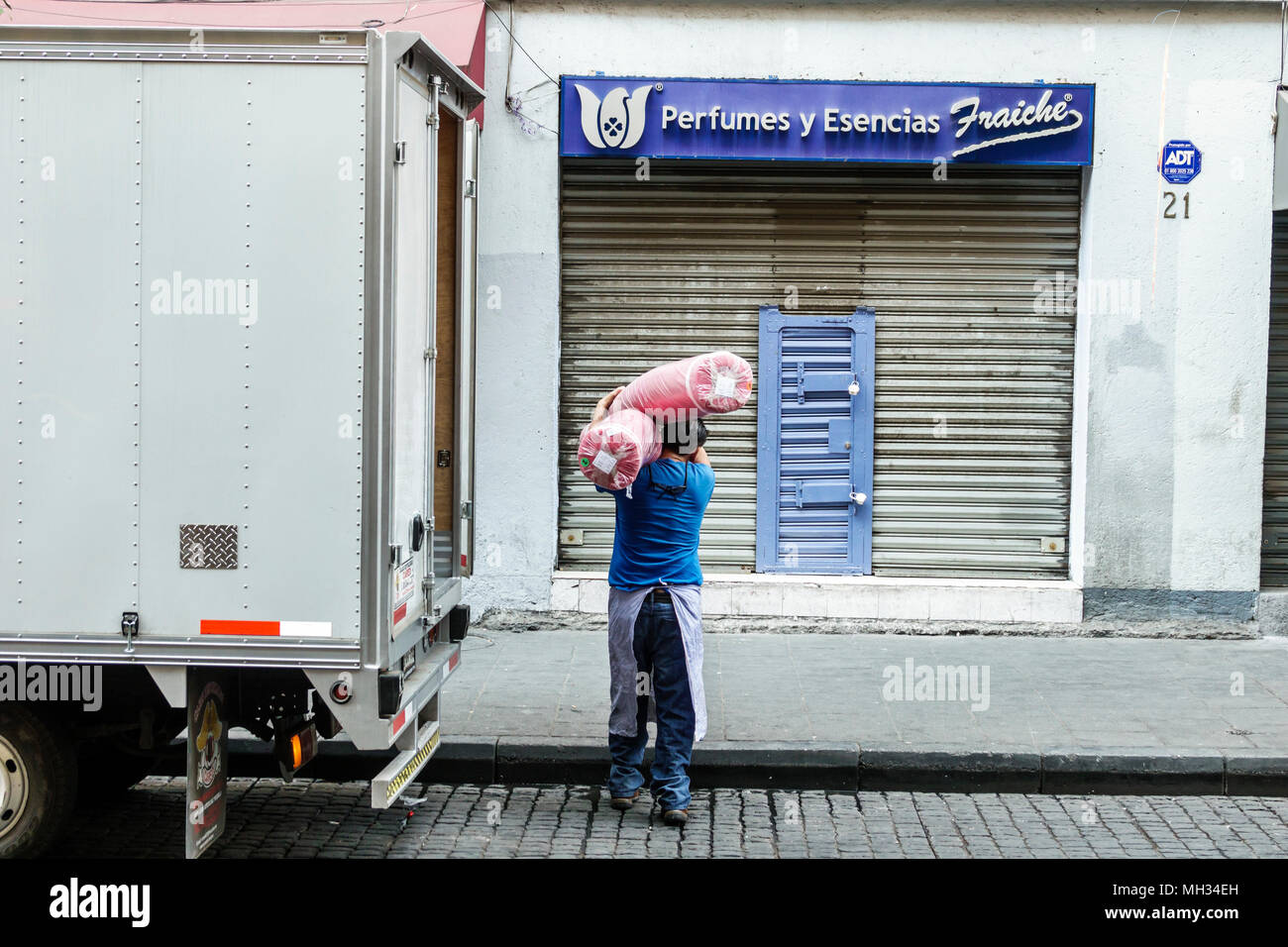 Mexico City,Mexican,Hispanic,historic Center Centre,5 de Febrero,truck,delivery man,carrying load,manual labor MX180306002 Stock Photo