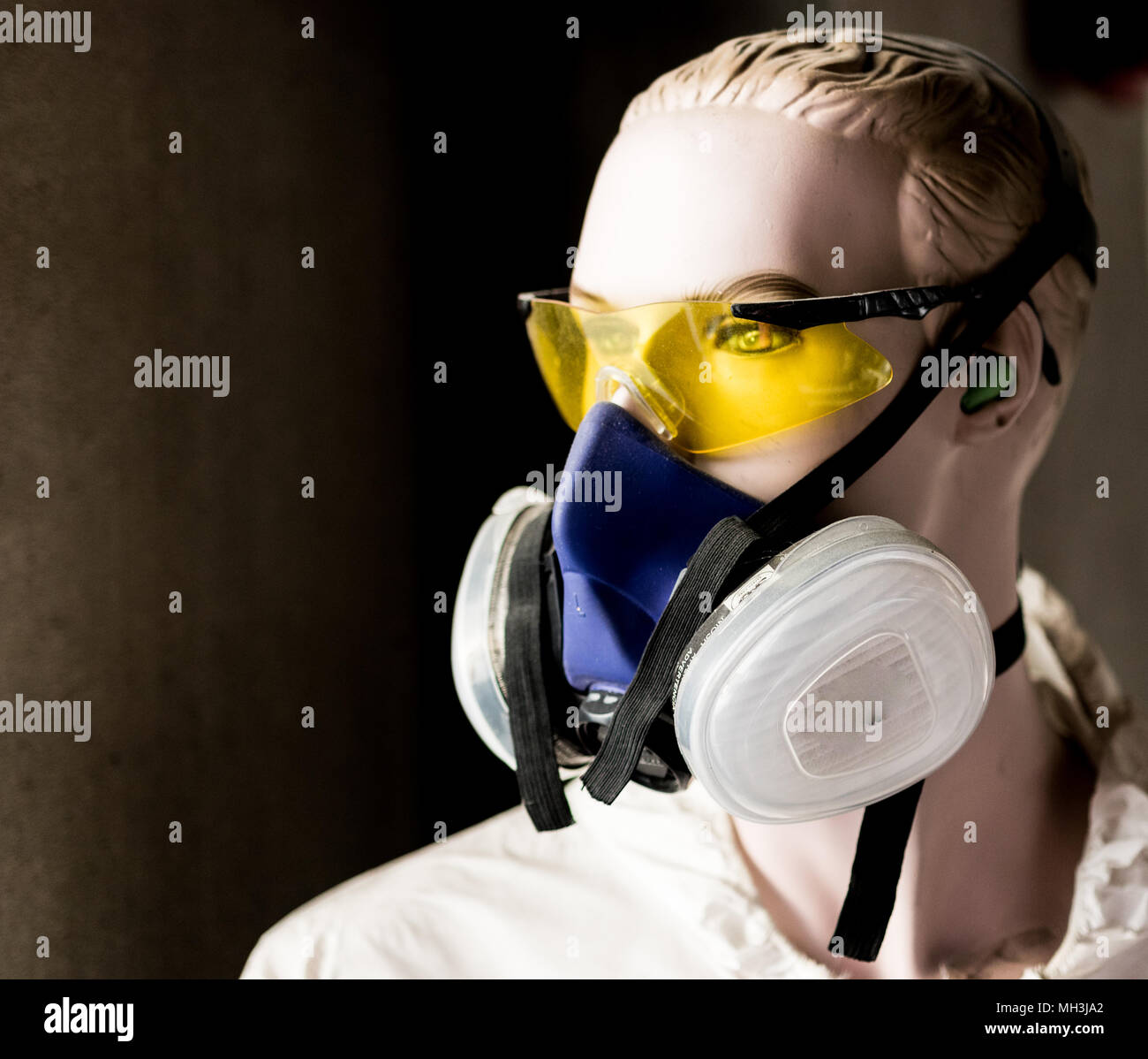 Safety mannequin modeling yellow glasses and respirator mask Stock Photo Alamy