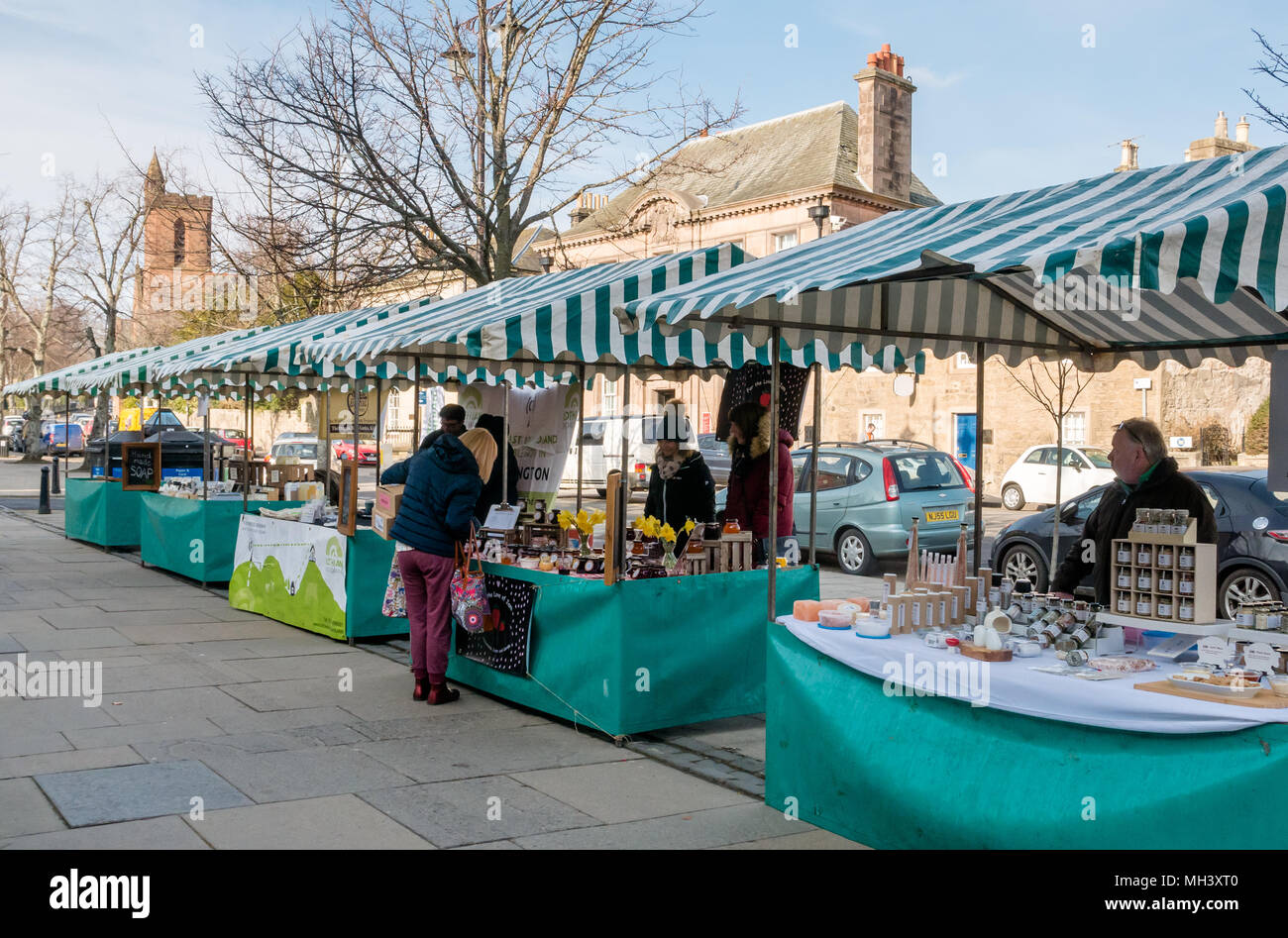 Outdoor market stalls at Haddington Farmers Market, Place d'Aubigny, Court Street, East Lothian, UK on sunny Winter day Stock Photo