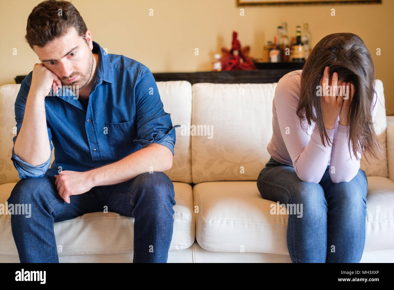 Couple crisis after relationship breakup and boyfriend betrayal and infidelity confession Stock Photo
