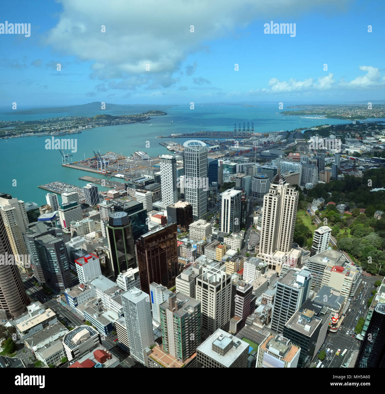 Auckland city & harbour vertical aerial panorama looking east to Rangitoto Island. In the foreground are the buildings of the Central business distric Stock Photo