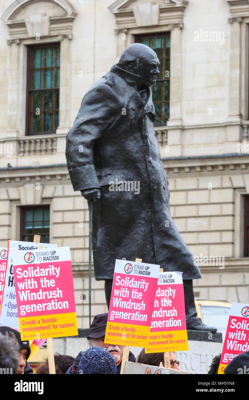 Westminster, London, 30th April 2018. People protest in solidarity, standing in front of the Churchill Statue in Parliament Square. A 'Solidarity with the Windrush generatiion' protest is organised by Stand Up to Racism to signal unity and common anti-racism aims. Credit: Imageplotter News and Sports/Alamy Live News Stock Photo