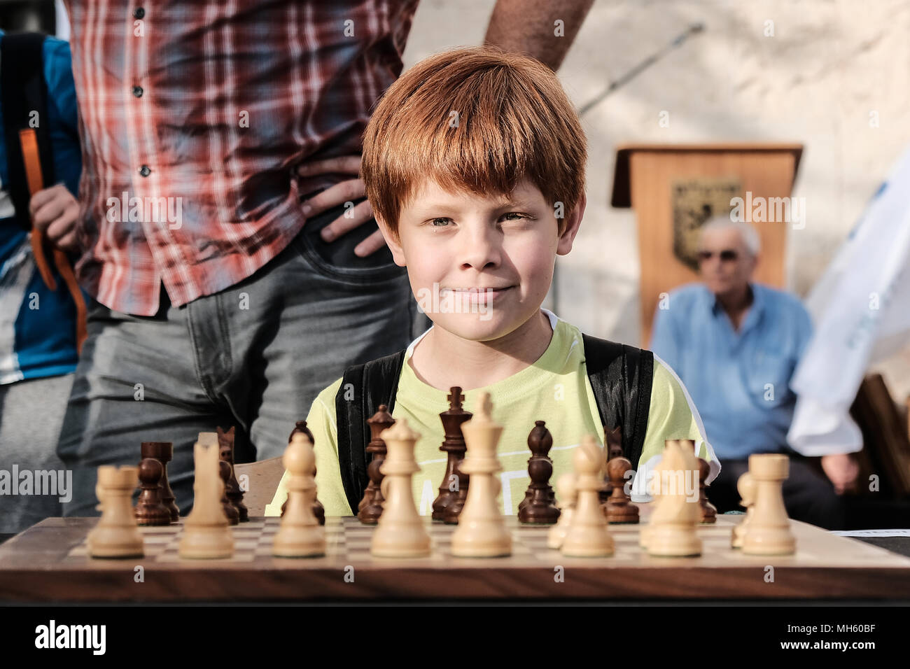 Jerusalem, Israel. 30th April, 2018. Young chess players await the opening of a chess game against either Anatoly Yevgenyevich Karpov, 66, Russian chess grandmaster or Viswanathan 'Vishy' Anand, 49, Indian chess grandmaster, about to play chess against dozens of Israeli youth champions simultaneously at the Jaffa Gate in the framework of Israel's 70th Independence Day celebrations. Credit: Nir Alon/Alamy Live News Stock Photo