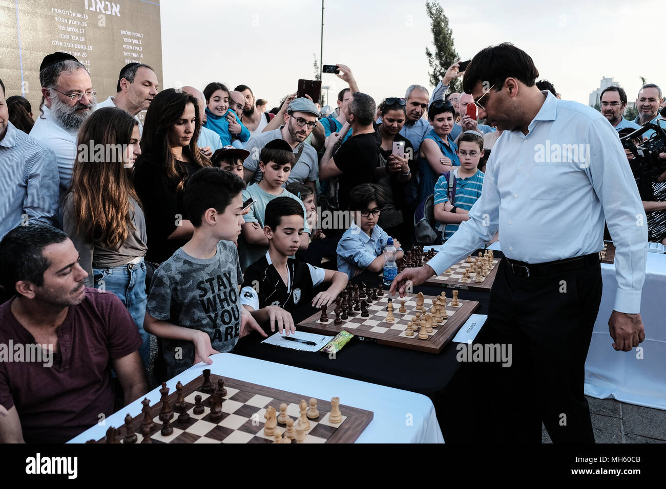 Jerusalem, Israel. 30th April, 2018. VISWANATHAN VISHY ANAND, 49, Indian chess grandmaster, plays chess against dozens of Israeli youth champions simultaneously at the Jaffa Gate in the framework of Israel's 70th Independence Day celebrations. Credit: Nir Alon/Alamy Live News Stock Photo
