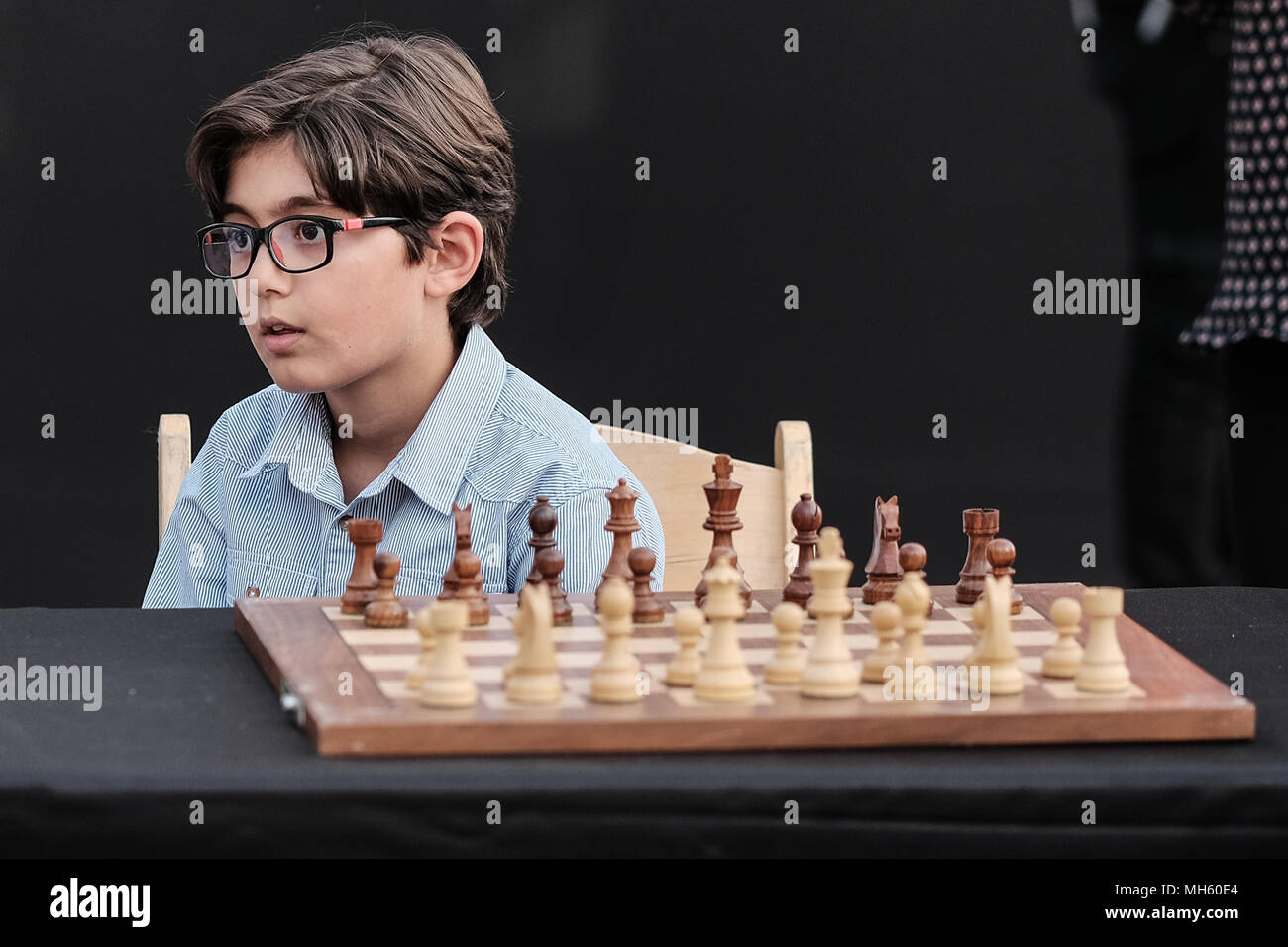 Jerusalem, Israel. 30th April, 2018. Young chess players await the opening of a chess game against either Anatoly Yevgenyevich Karpov, 66, Russian chess grandmaster or Viswanathan 'Vishy' Anand, 49, Indian chess grandmaster, about to play chess against dozens of Israeli youth champions simultaneously at the Jaffa Gate in the framework of Israel's 70th Independence Day celebrations. Credit: Nir Alon/Alamy Live News Stock Photo