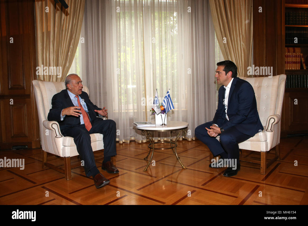 (180430) -- ATHENS, April 30, 2018 (Xinhua) -- Greek Prime Minister Alexis Tsipras (R) meets with Secretary-General of the Organization for Economic Cooperation and Development (OECD) Angel Gurria at the Prime Minister office in Athens, Greece, on April 30, 2018. The time has come for further Greek debt relief, Angel Gurria said here on Monday after meeting with Alexis Tsipras. (Xinhua/Marios Lolos) Stock Photo