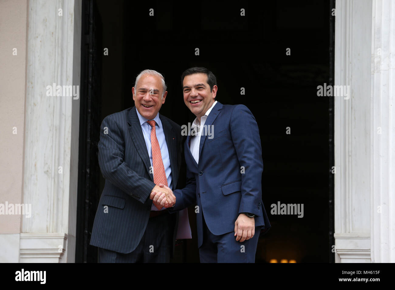 (180430) -- ATHENS, April 30, 2018 (Xinhua) -- Greek Prime Minister Alexis Tsipras (R) welcomes Secretary-General of the Organization for Economic Cooperation and Development (OECD) Angel Gurria at the Prime Minister office in Athens, Greece, on April 30, 2018. The time has come for further Greek debt relief, Angel Gurria said here on Monday after meeting with Alexis Tsipras. (Xinhua/Marios Lolos) Stock Photo