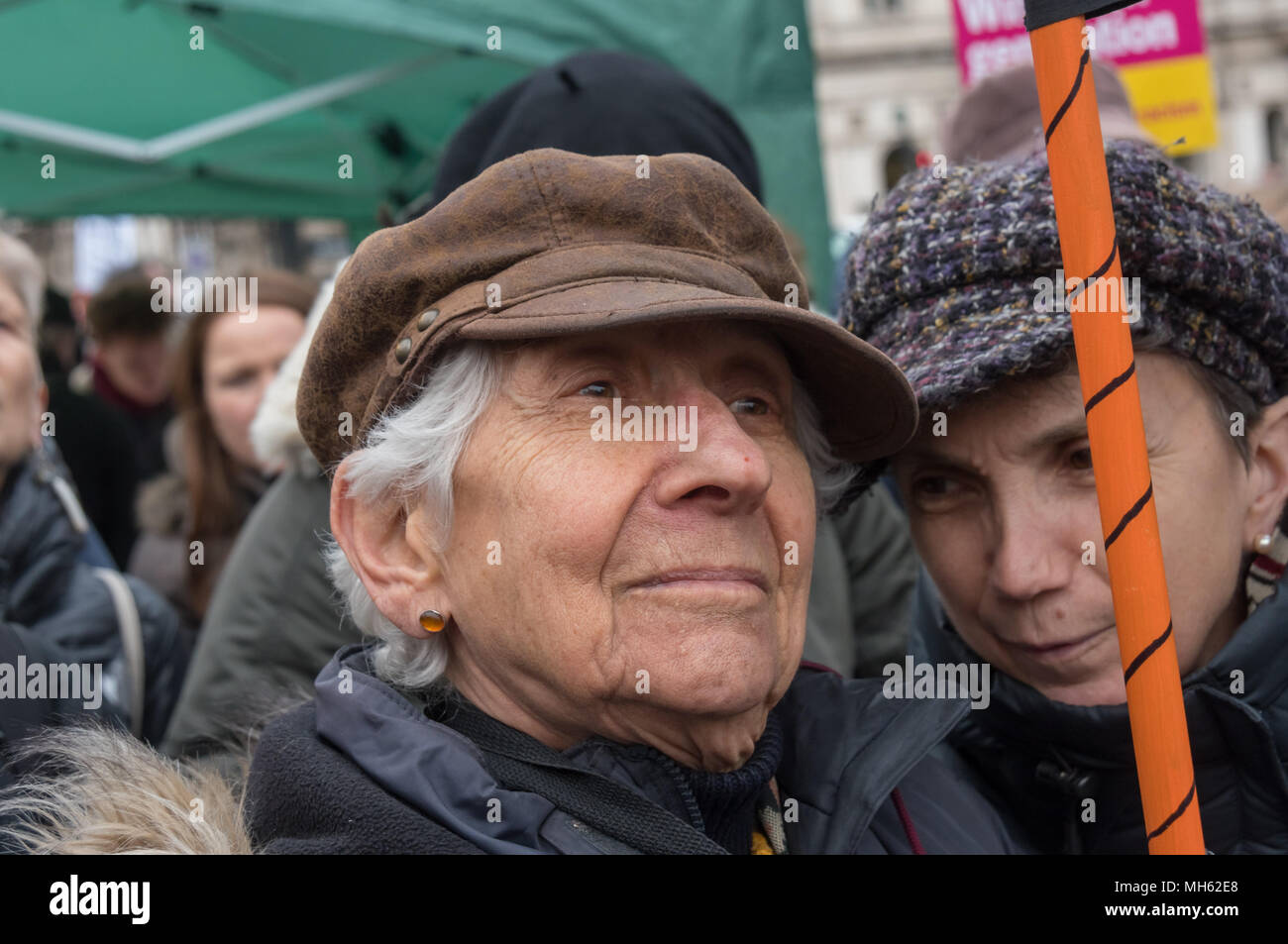 London, UK. 30th April 2018.  Selma James, author of The Power of Women and the Subversion of the Community, co-founder of the International Wages for Housework Campaign, and coordinator of the Global Women's Strike listens at the protest in support of the petition calling for an end to the deportations of migrants in the 'Windrush generation' who arrived in Britain between 1948 and 1971. It calls on the government to change the burden of proof which means they are now required to prove their right to remain, and to provide compensation for any loss and hurt.. Most of those who have been depor Stock Photo
