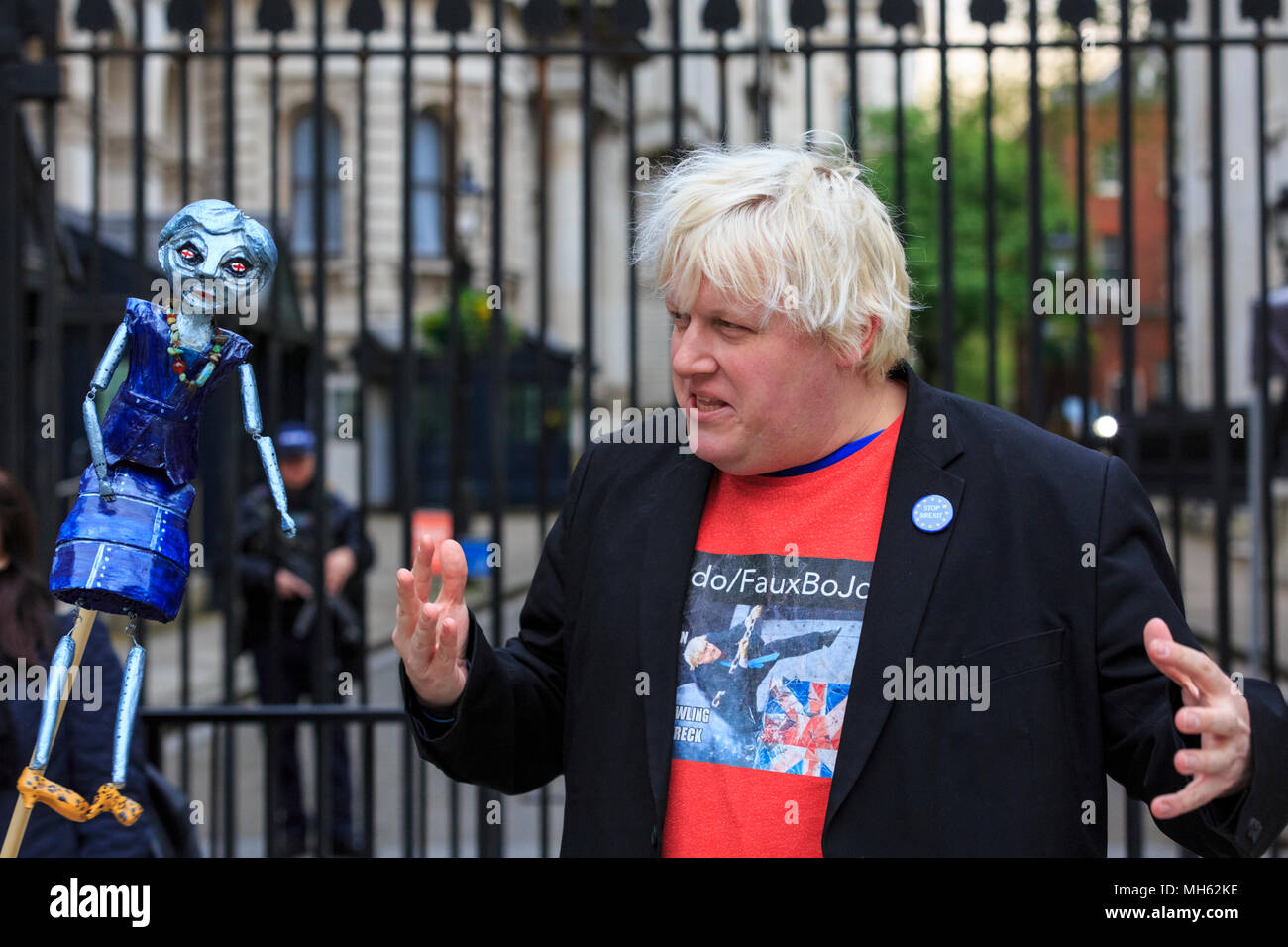 Westminster, London, 30th April 2018. 'Faux BoJo', a.k.a. Drew Galdron, performs as Foreign Secretary Boris Johnson opposite 10 Downing Street, singing with a puppet of Theresa May. Anti-Brexit and pro-European protesters gather outside and opposite 10 Downing Street for the 'Vigil against Brexit', while the House of Lords again debates the European Union (Withdrawal) Bill. Stock Photo