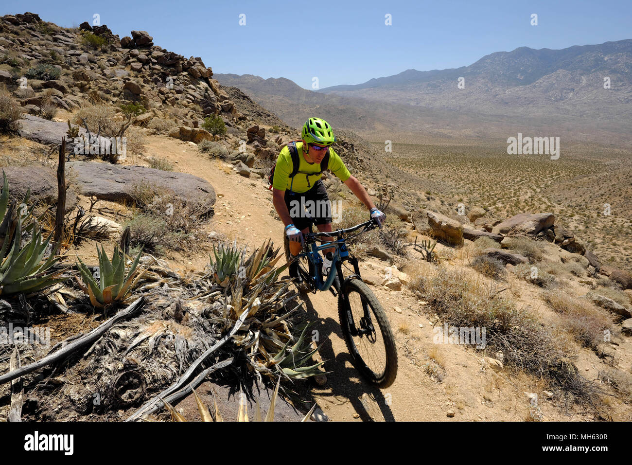 Palm Springs, California, USA. 28th Apr, 2018. Mountain bikers pass cactus and high desert vistas on the trail. This is a true Southern California Epic mountain bike ride in the Santa Rosa and San Jacinto Mountains National Monument. Offering huge vistas, off-camber narrow single track, ridges, stream beds, rocks, sand, cactus. This point-to-point route passes a varied array of high desert trails from the foot of the north slope of Santa Rosa Mountains and Agua Caliente Indian Reservation at 4500 feet down to Palm Springs 29 miles away at 500 feet. (Credit Image: © Ruaridh Stewart via ZUMA Wi Stock Photo