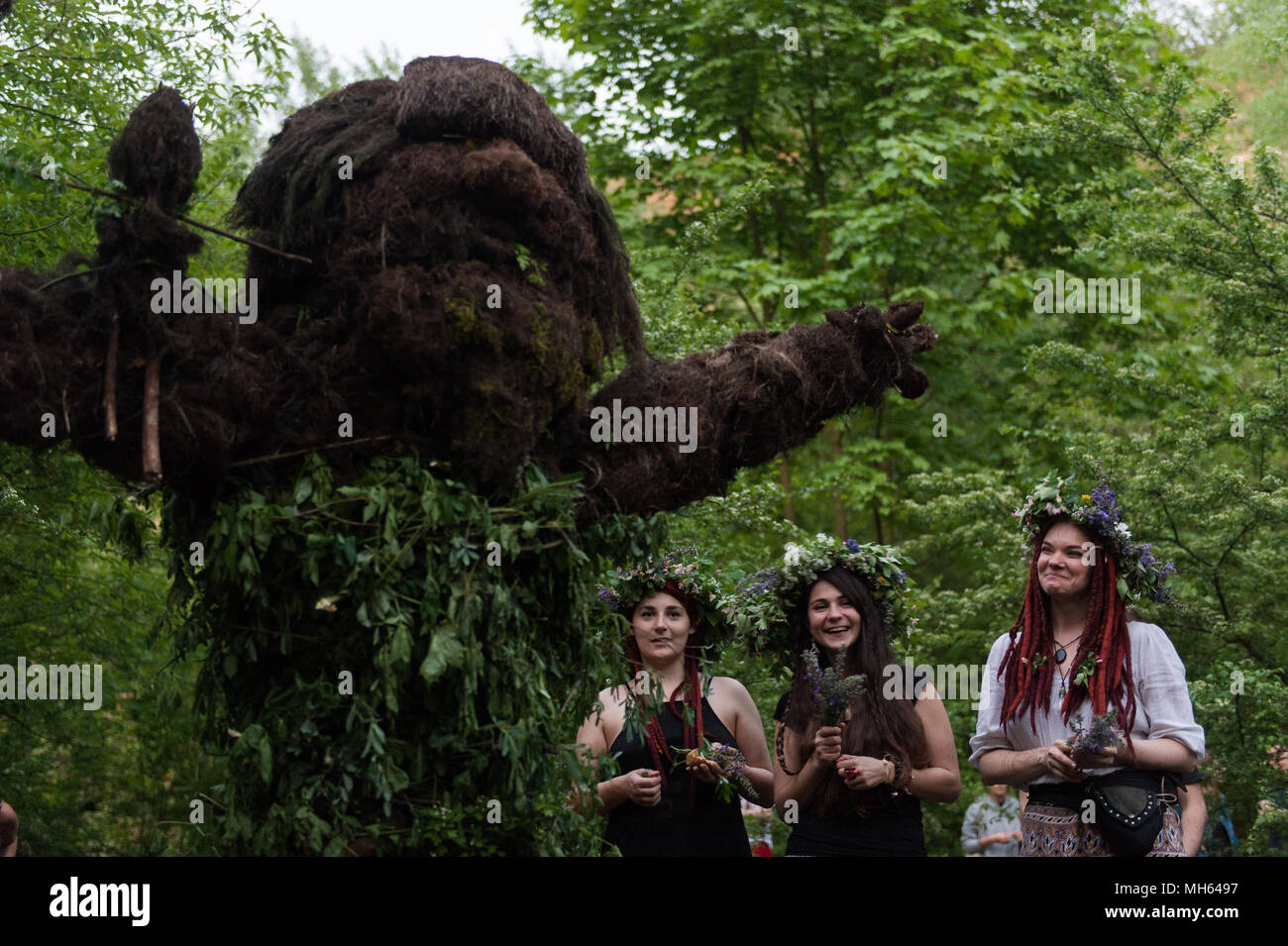 A participant attends the Beltane feast of Fire next to Krakau Mound in Krakow. The Beltane Fire Festival is an annual participatory arts event held on the night 30 April to mark the beginning of the Summer. Stock Photo