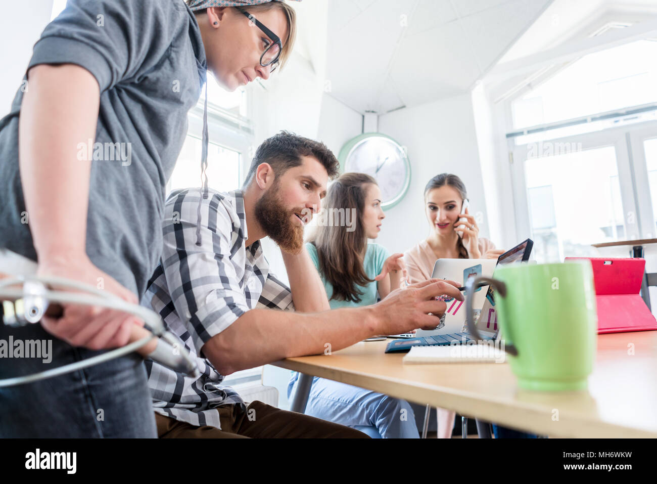 Self-employed young man analyzing a difficult task while working Stock Photo