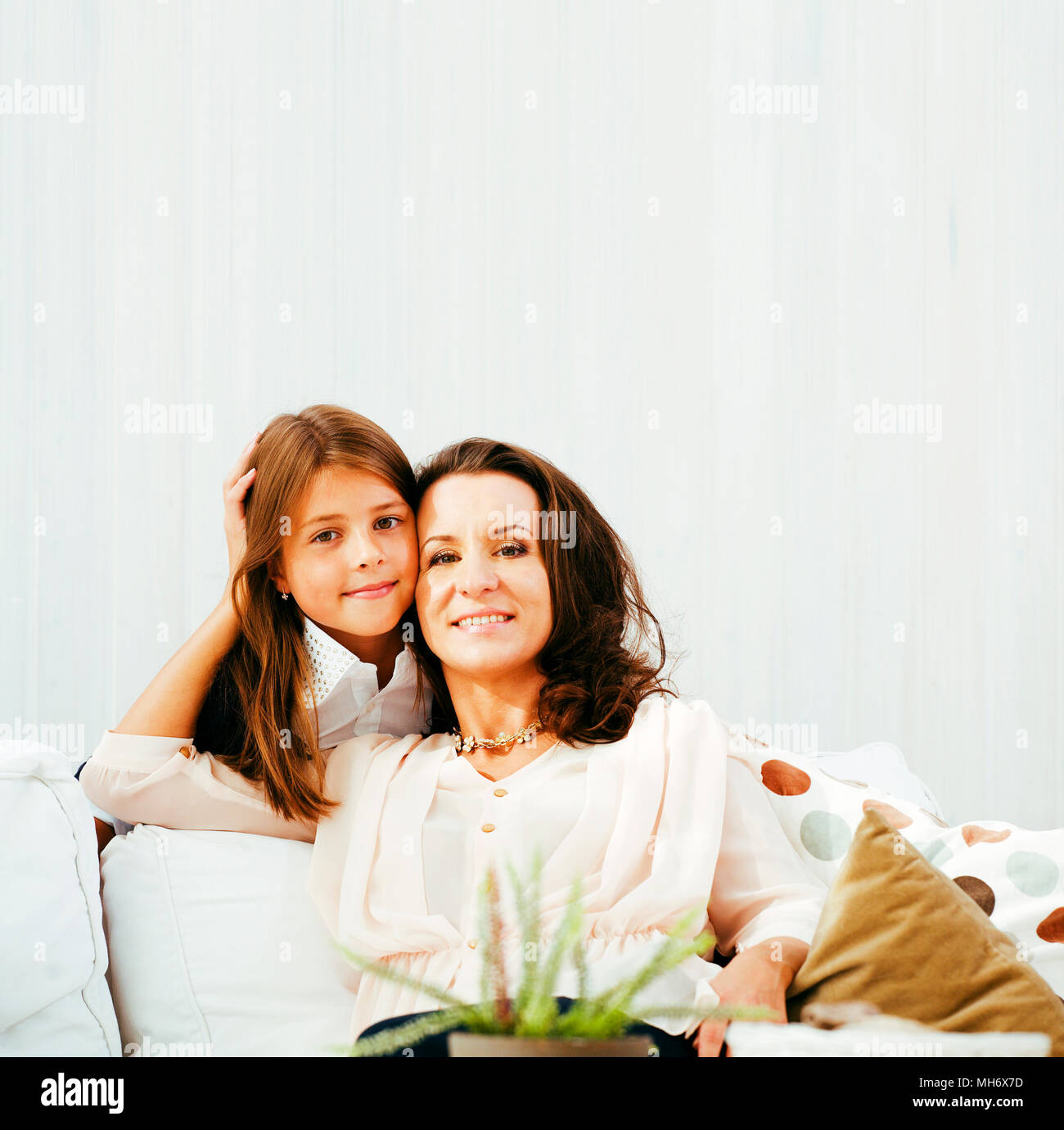 happy mother with daughter at home, real family Stock Photo