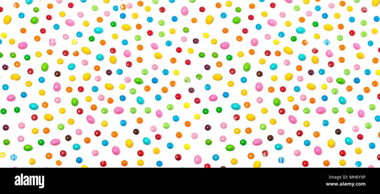 Colorful chocolate candy pills isolated on white background. Stock Photo
