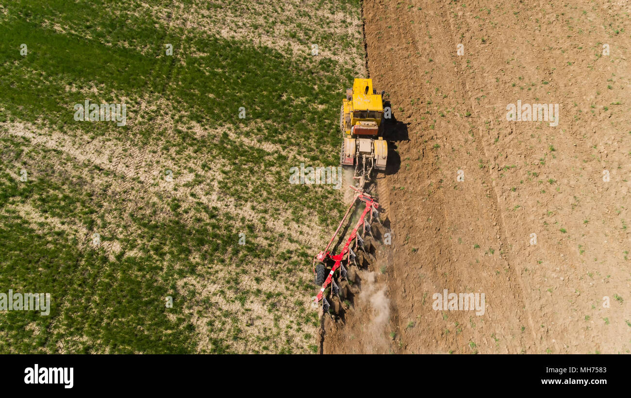 Aerial view of a tractor on a field Stock Photo - Alamy