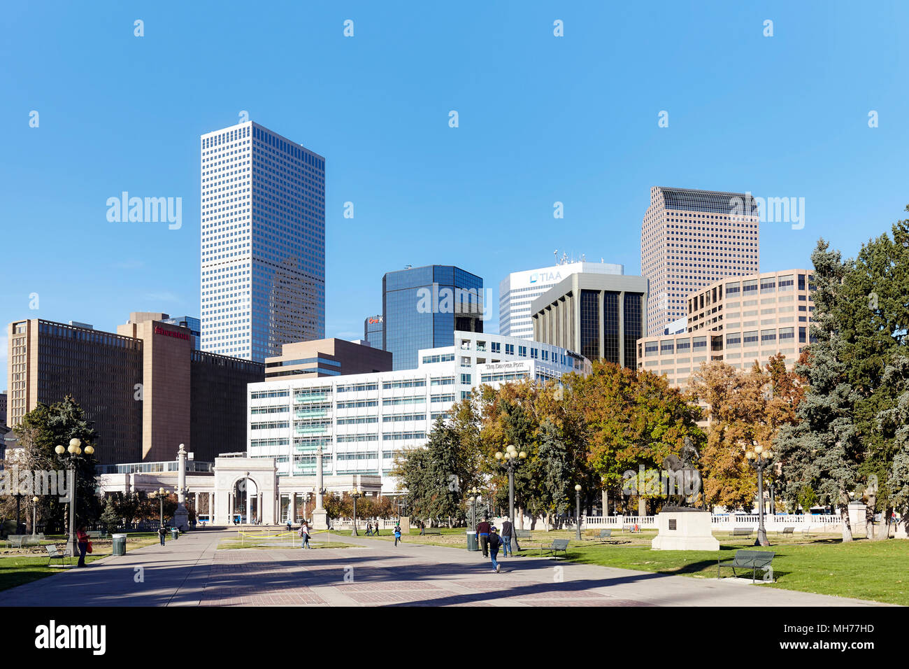 Denver, USA - November 04, 2016: Denver modern skyline seen from the Civic Center Park on a sunny day.Civic Center Park on a sunny day. Stock Photo