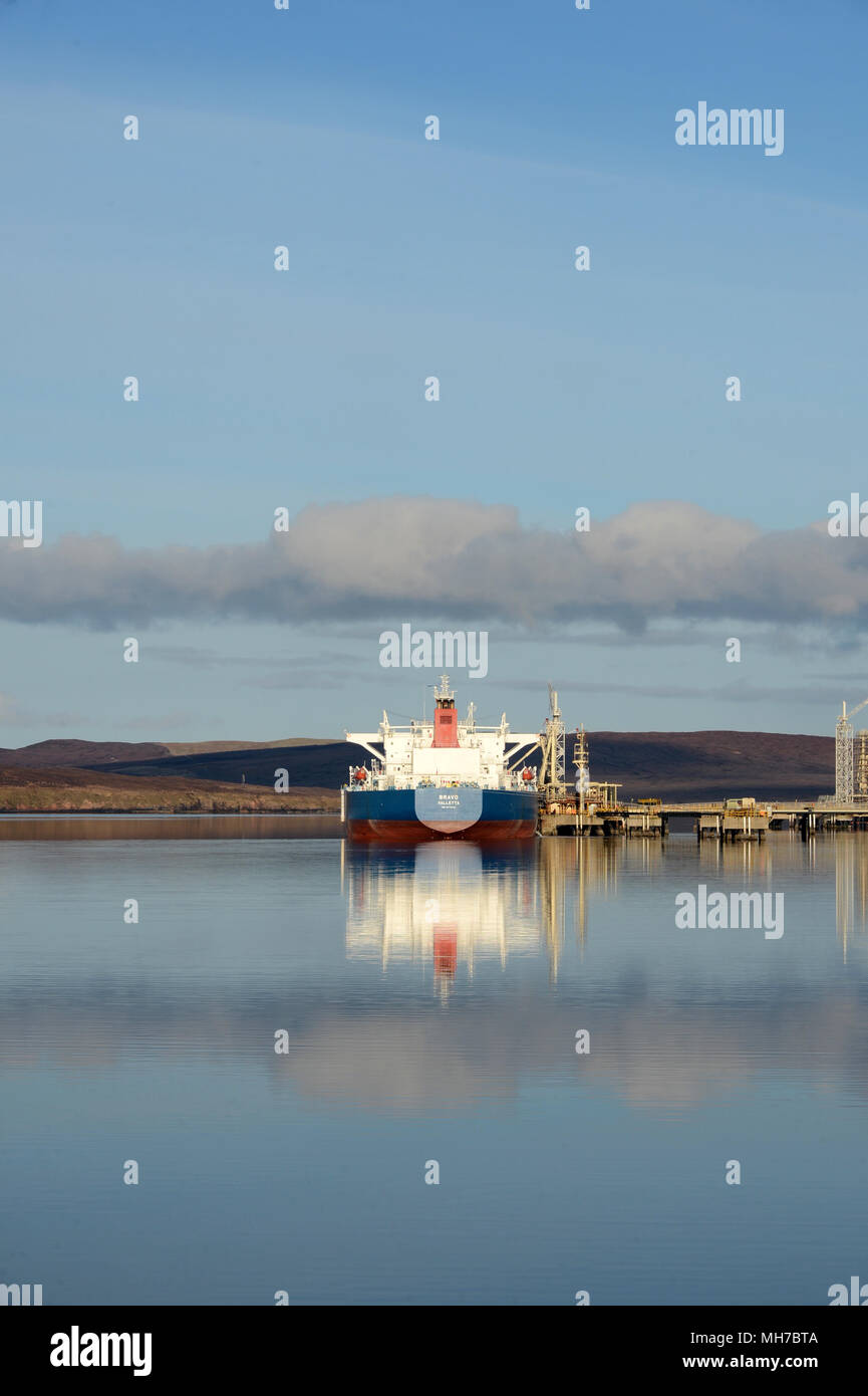 Tankers at berth at piers at Sullom Voe Terminal on a tranquil summers morning Stock Photo
