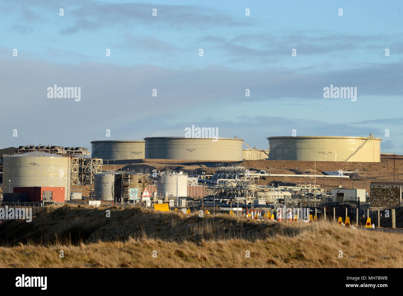 Crude Oil tanks on Sullom Voe oil terminal in the Shetland Isles Stock Photo