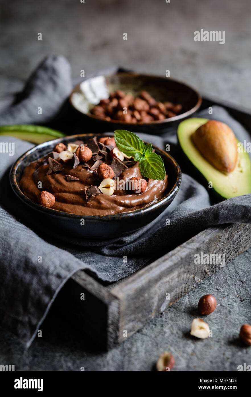 Raw avocado chocolate mousse topped with hazelnuts Stock Photo Alamy