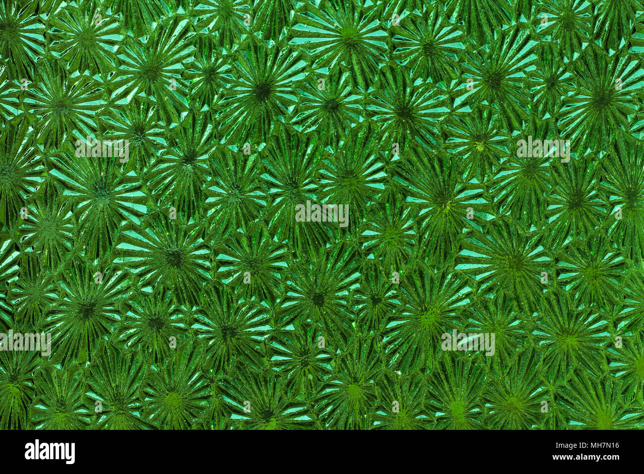 Ornate green glass - detail of the surface - glass texture - patterned glass Stock Photo