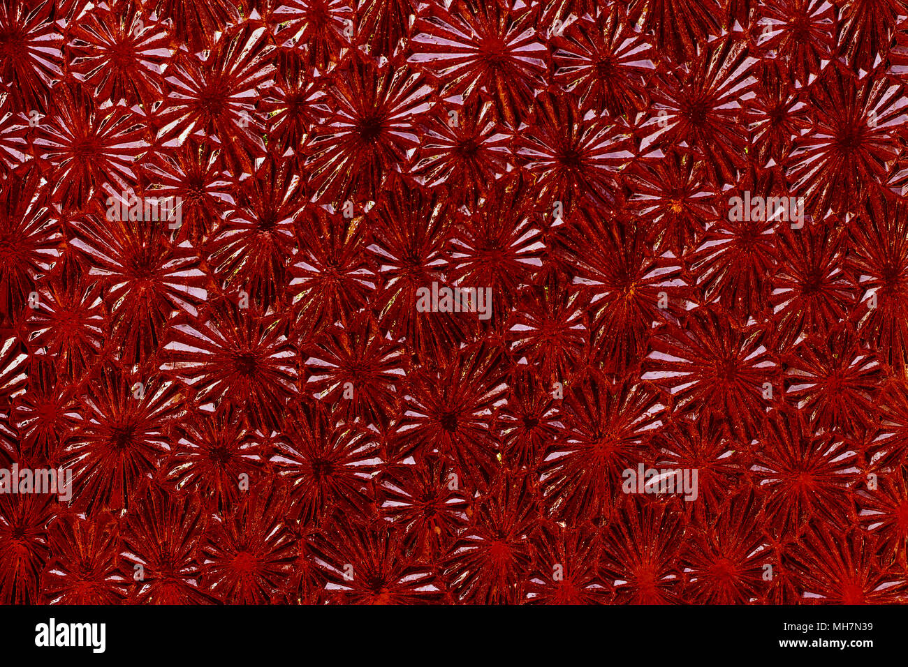 Ornate colored glass - detail of the surface - glass texture - patterned glass Stock Photo