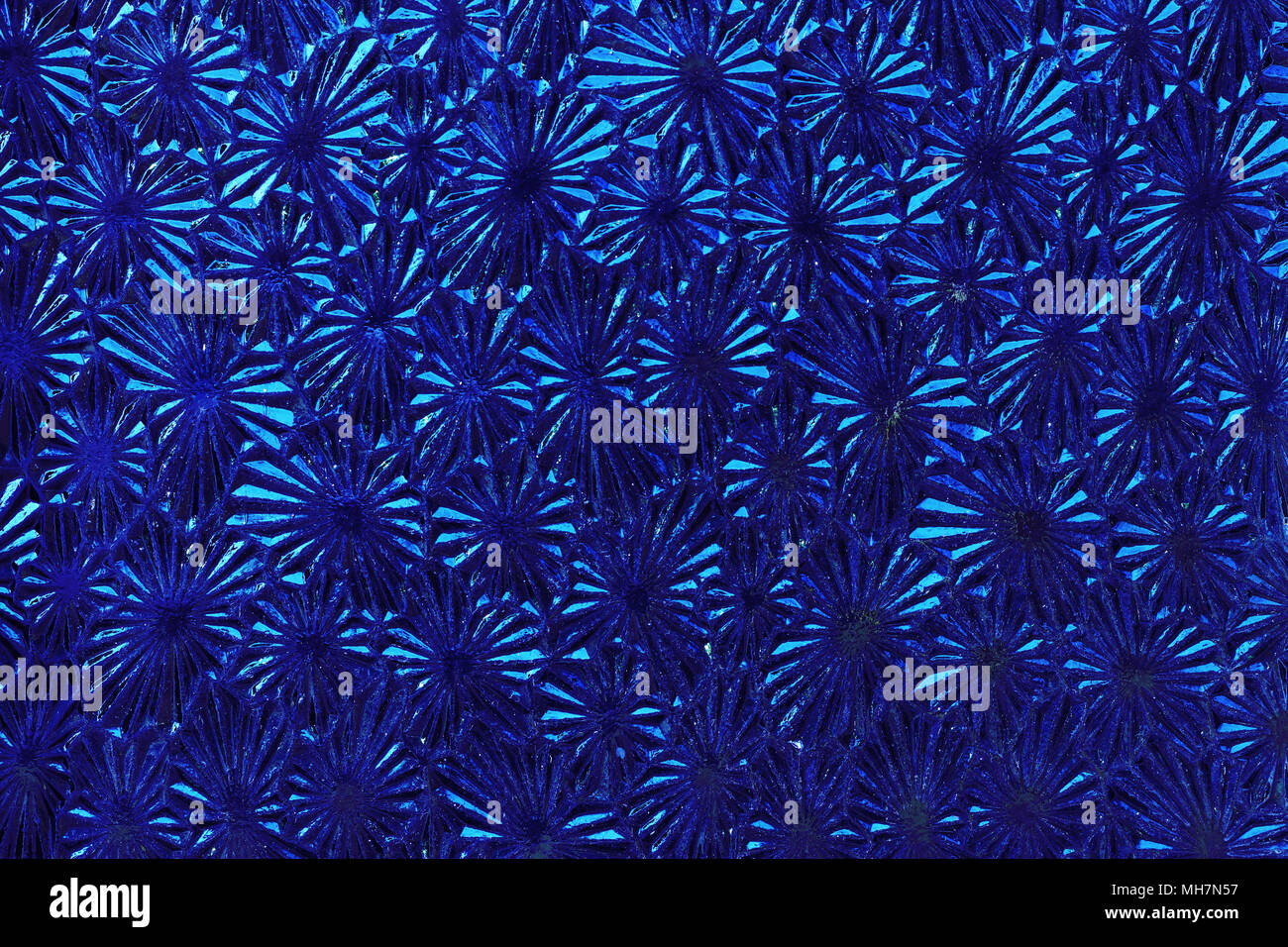 Ornate colored glass - detail of the surface - glass texture - patterned glass Stock Photo
