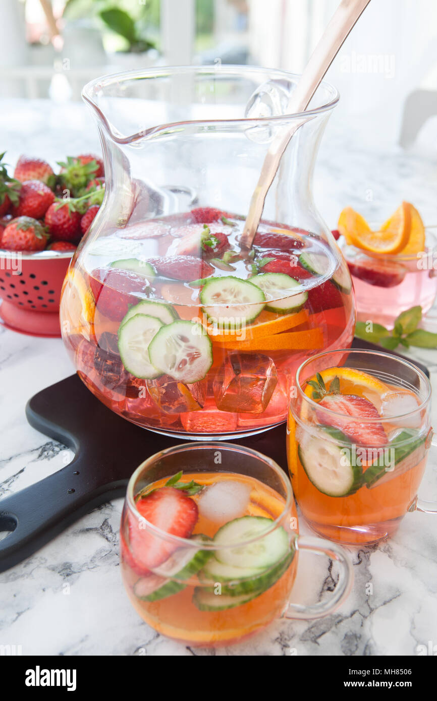 Homemade fruit punch with strawberry, orange and cucumber Stock Photo